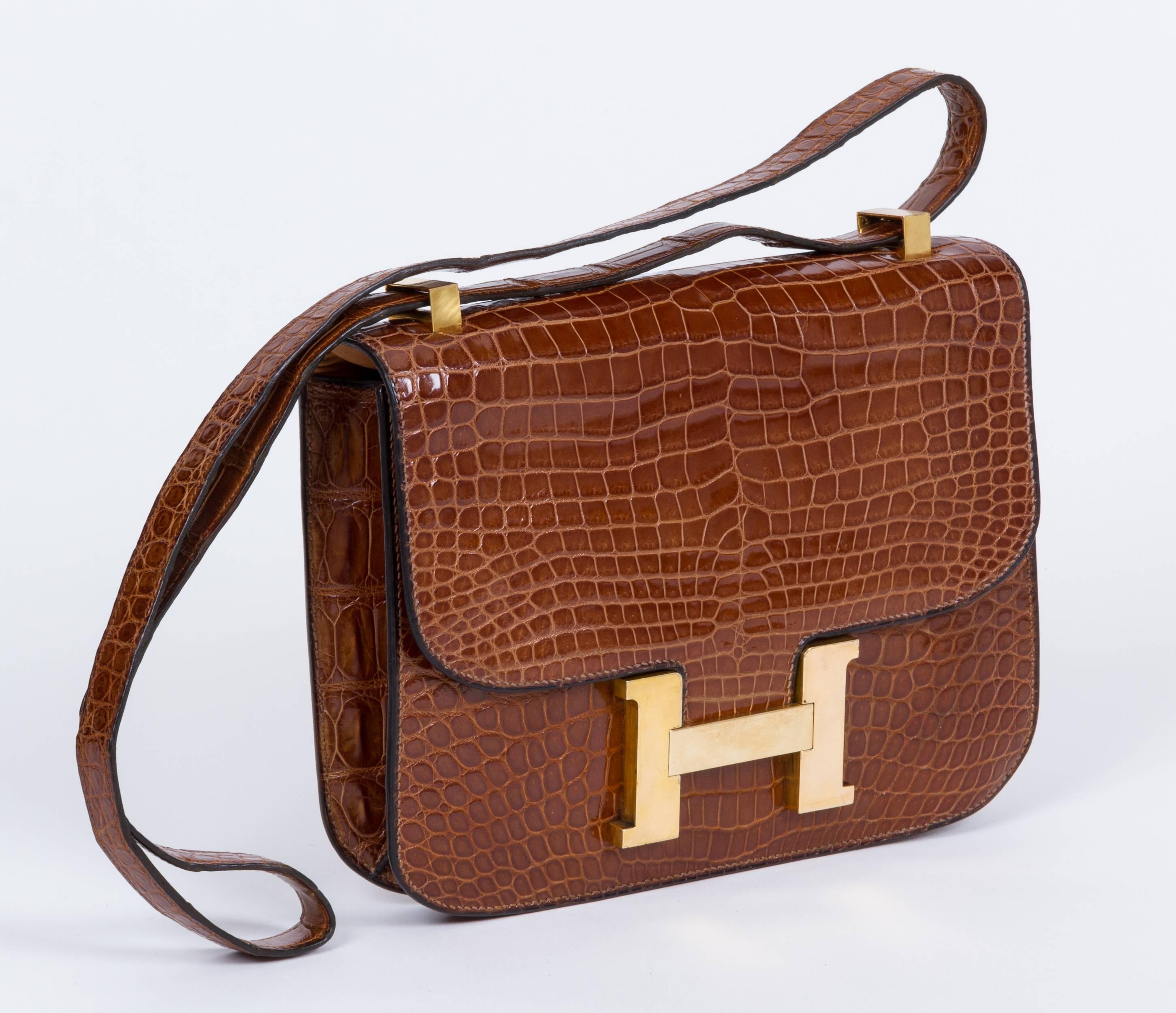 Hermes classic and beautiful vintage crocodile miel constance bag. Pre stamp production. Crocodile leather is in excellent condition, metal front H has minor scuffs. Shoulder drop 8.5