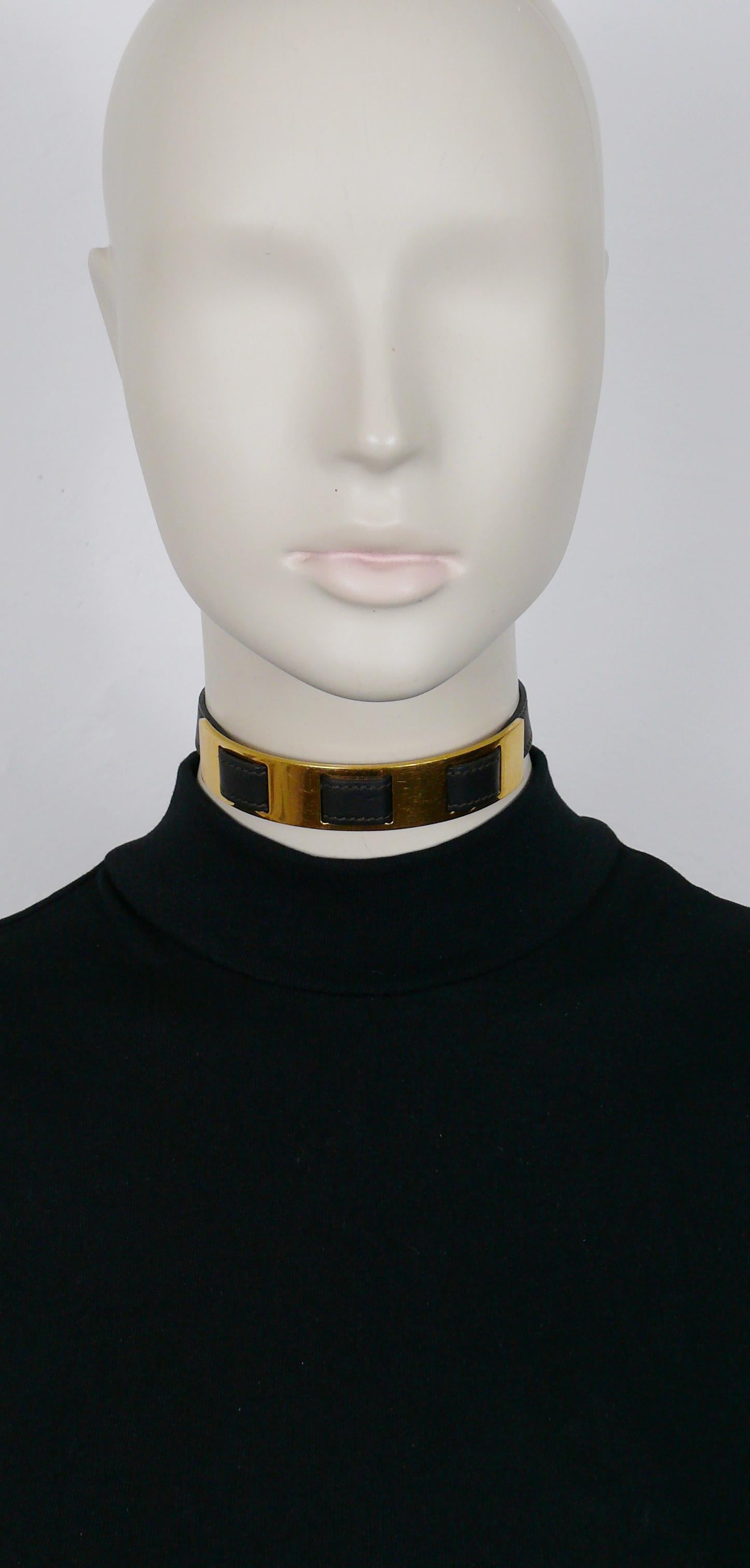 HERMES vintage choker necklace made of dark brown leather with golde tone panel.

CLOU DE SELLE snap button closure.

Embossed HERMES on the reverse of the gold panel.
Marked HERMES PARIS Made in France on the reverse of the leather.
Letter date B