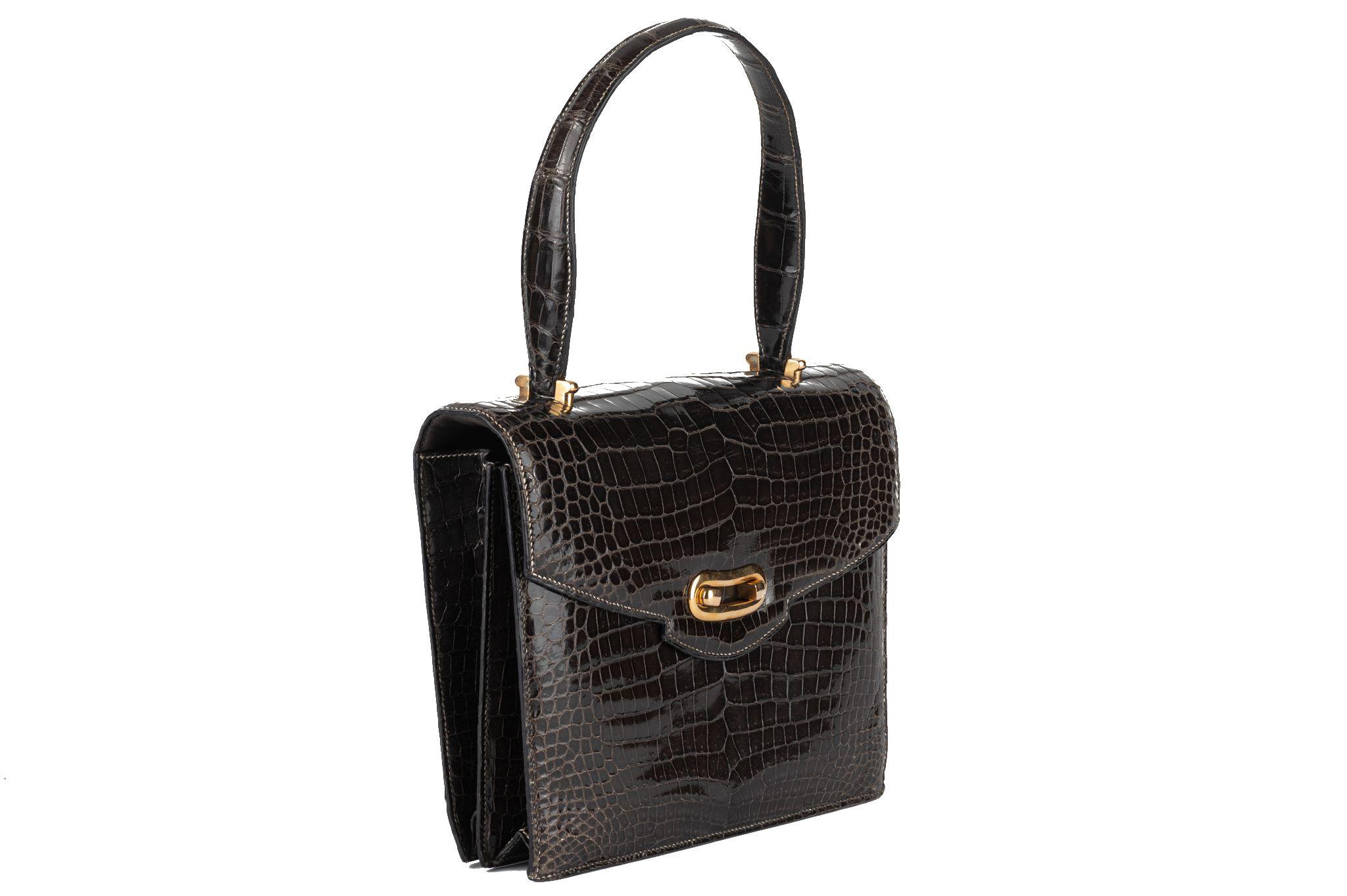 Hermès dark grey crocodile leather vintage handbag. Excellent condition , gold tone hardware. Comes with original dust cover and box .