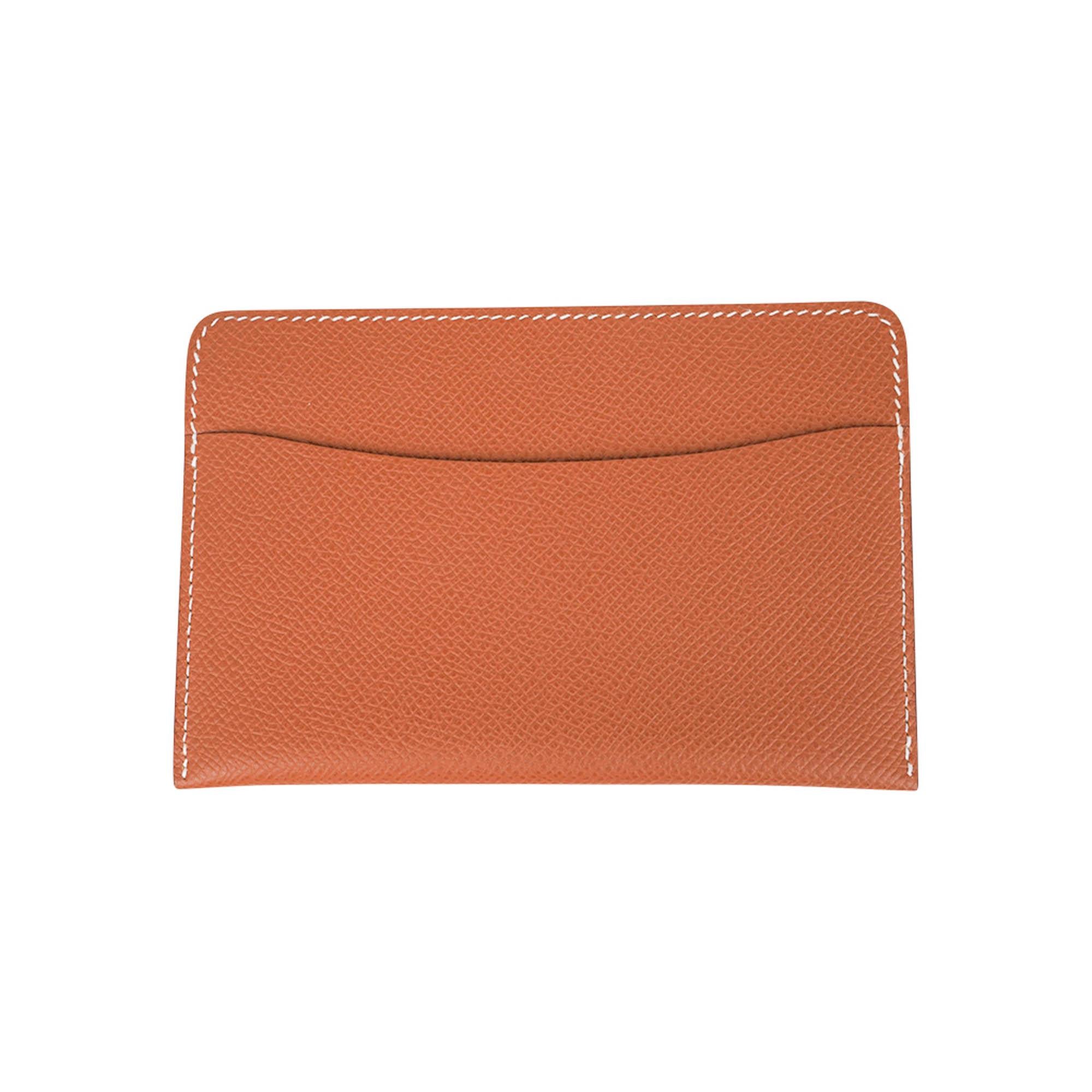 Mightychic offers a rare and limited edition Hermes Duo Card Holder is finely crafted from durable Epsom leather in a rich Gold hue, accented with crisp bone signature topstitching.
Designed for elegance and function, it features two front slots for