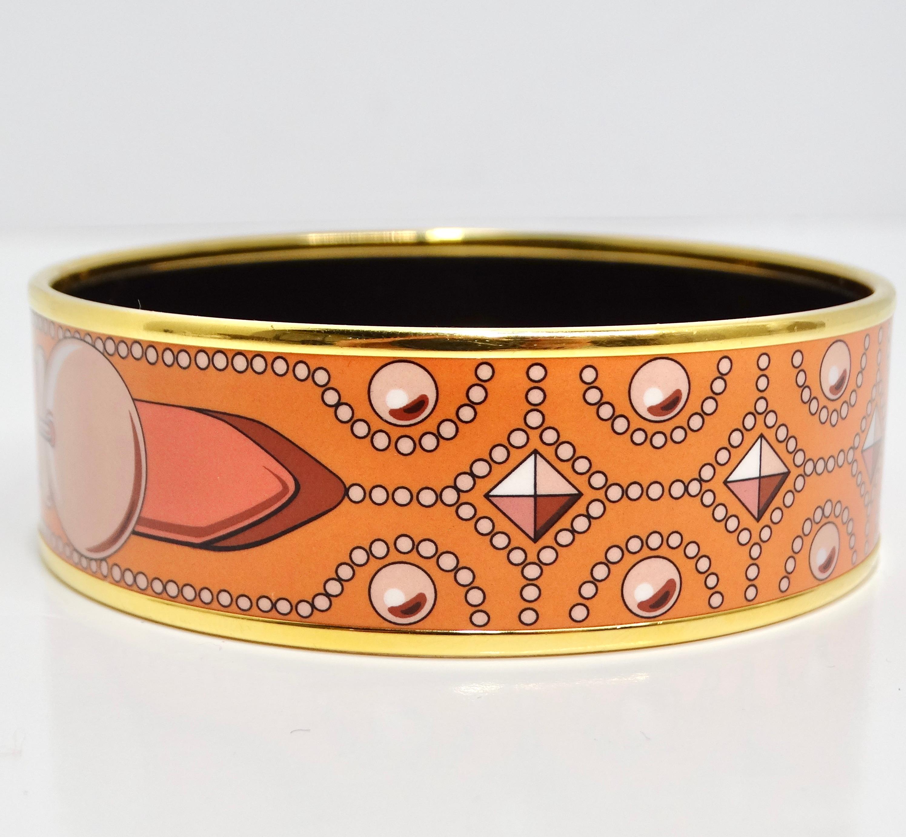 Introducing the Hermes Vintage Enamel Buckle Bracelet, a stunning and iconic piece from the late 90s/early 2000s that embodies the timeless elegance and craftsmanship of the Hermes brand. Crafted with meticulous attention to detail, this bangle