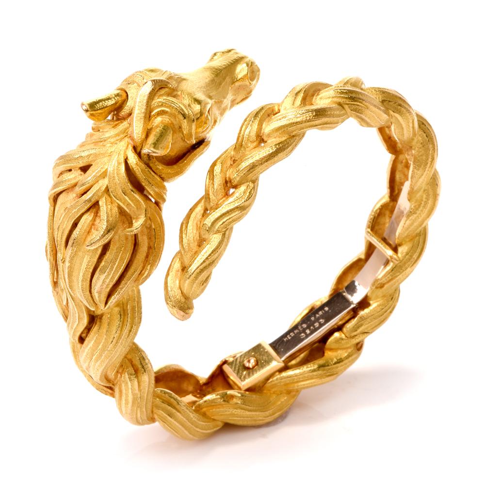 This authentic Hermes bracelet with horse head motif circa 1960’s is of French provenance, rendered in 18K matted finely textured yellow gold in a braided design. It depicts the anatomically accurate sculptured head of a horse, positioned at one