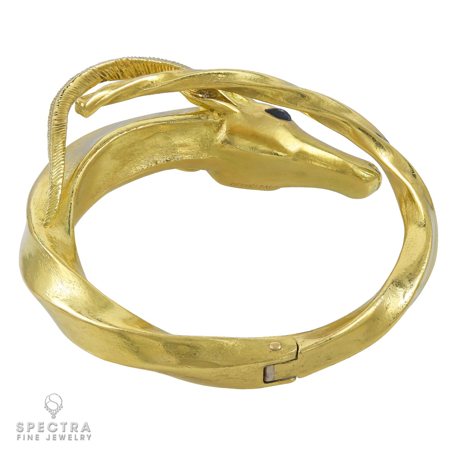 A unique vintage bangle designed as a Capricorn. 
Made by Hermes in 1970s.
Metal is 18k yellow gold, gross weight is 90.47 g.
Signed Hermès Paris.