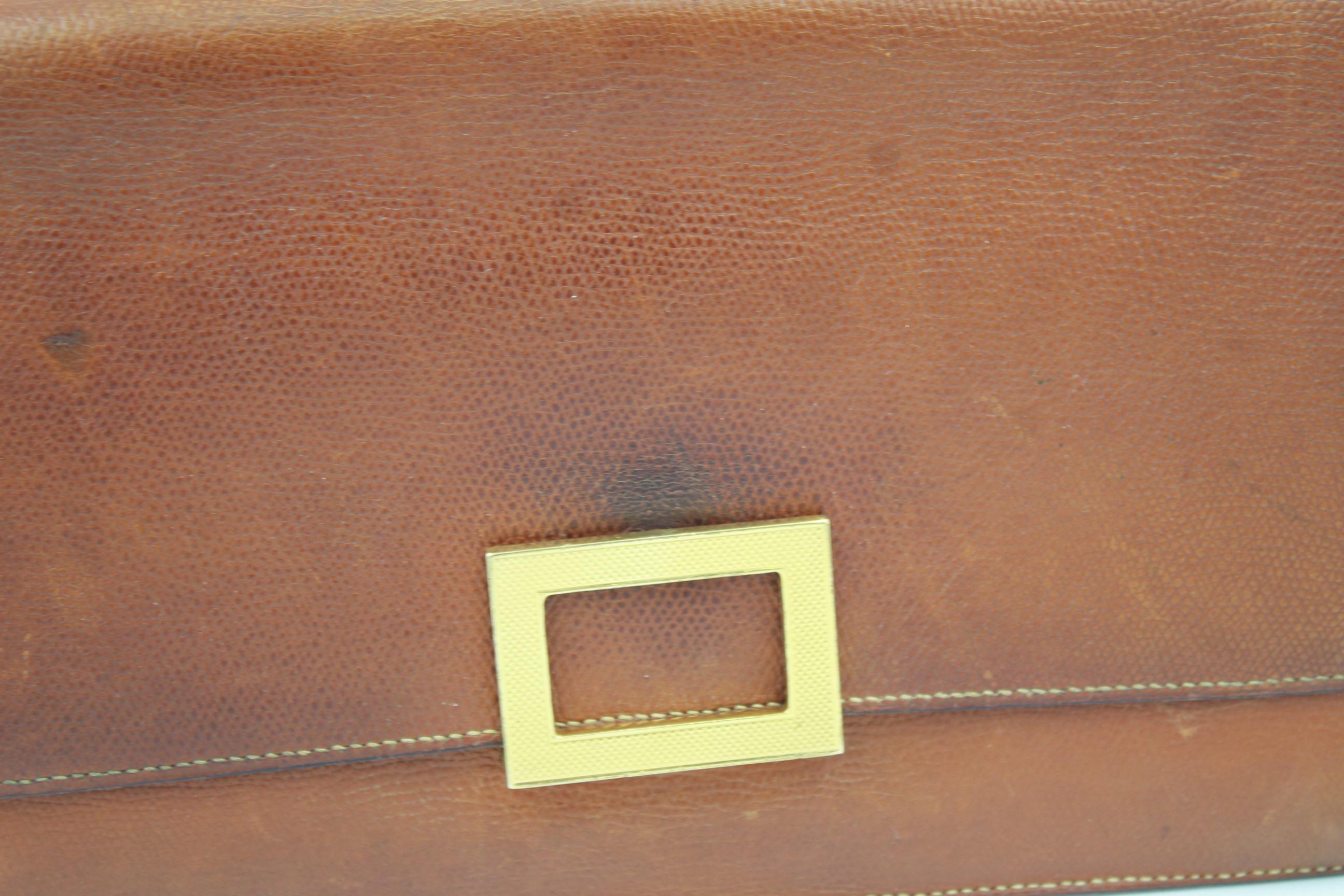 Vintage 60's Hermes bag in grained leather. Quite used but still nice to wear. Really nice clasp. Patina and stains all over. Size 25x15