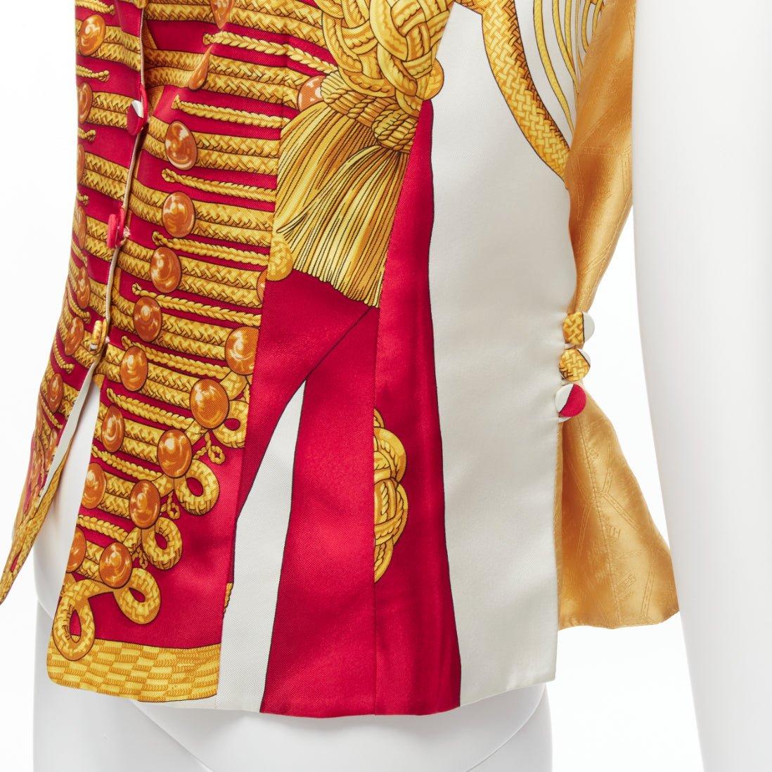rare HERMES Vintage Hussar Tromp Loeil print red gold silk buttons waistcoat vest FR40 L
Reference: TGAS/D00459
Brand: Hermes
Material: Silk
Color: Red, Gold
Pattern: Photographic Print
Closure: Button
Lining: Gold Silk
Extra Details: Gold Hermes