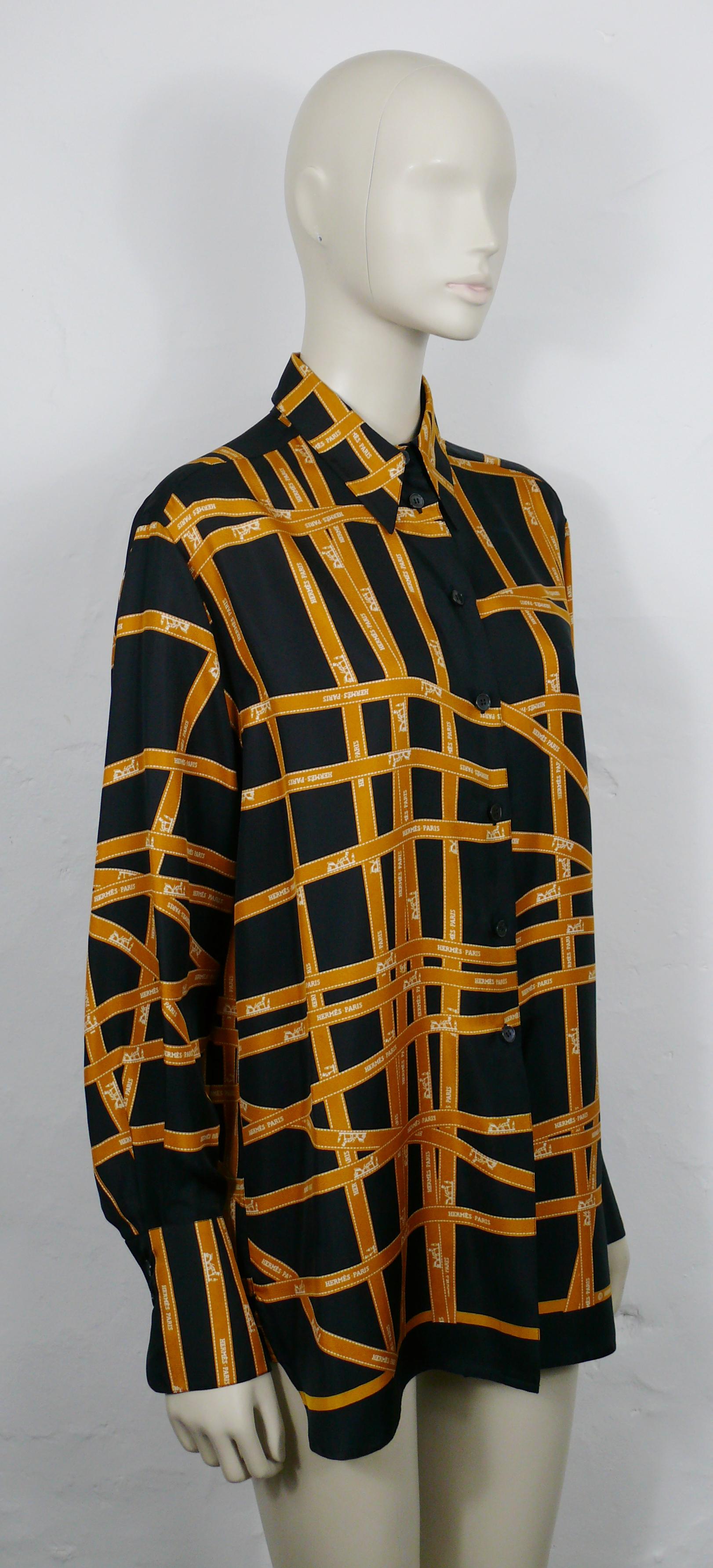 HERMES Paris vintage iconic Bolduc print silk shirt blouse.

This shirt features :
- Orange HERMES PARIS Bolduc print featuring white carriages and stitching on a black background.
- Long sleeves.
- Front button down closure
- 2 buttons on each
