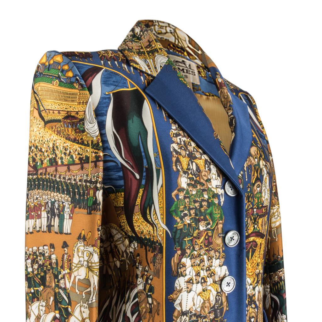 Guaranteed authentic Hermes rare vintage Grand Cortege A Moscou scarf print silk jacket in blue colour way.
Rich blue with browns, gold and greens create magnificently detailed horses and men in uniform.
Five button single breast with beautiful