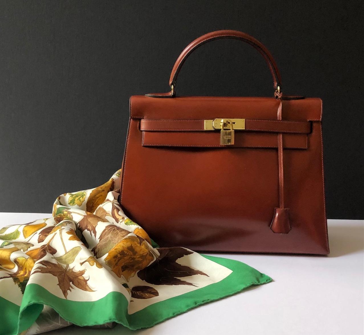 HERMÈS Vintage Kelly 32 Box Calf Sellier Leather Gold Hardware Cognac Iconic Bag C.1970 W/Box
A stunning collectable iconic ultra rare vintage 1970 Kelly 32 Cognac colour handbag. Considering it’s 53 years old age this Kelly bag is in very good