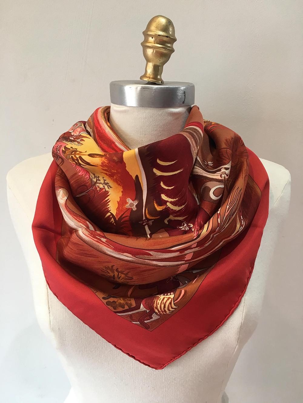 Hermes Vintage Kuggor Tree Silk Scarf in Red in excellent condition. Original silk screen design c.2001 by Sefedin Kwumi features a beautiful artistic painted depiction of a tree in various reds, pinks, corals, browns, tans, yellows, and more in a
