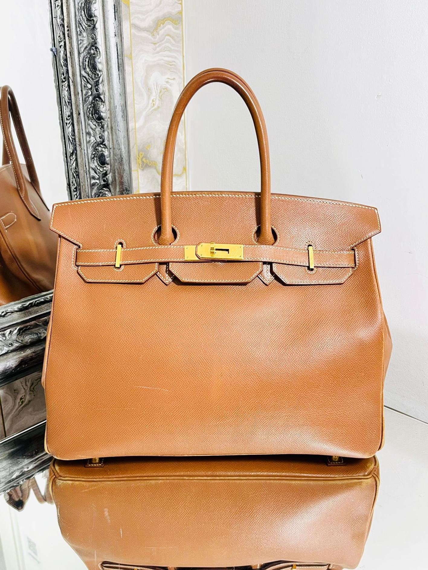 Hermes Vintage Leather Birkin 35

From 19881 in  Courcheval leather and brand colour Gold with gold plated hardware. 

Twist lock closure and rolled leather carry handles.

Size - Height 28cm, Width 35cm, Depth 18cm

Condition - Vintage - Fair (