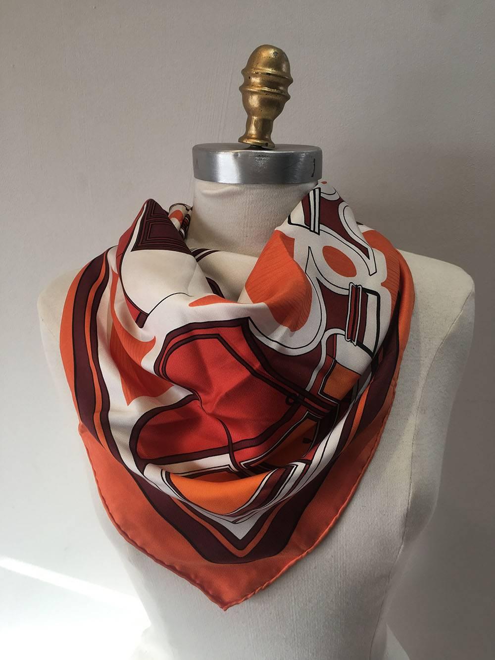 RETRO Vintage Hermes les coup silk scarf in excellent condition.  Original silk screen design c1970 by Françoise De La Perriere features a mod retro abstract design in colorful oranges.  100% silk, hand rolled hem, made in France.  Tag attached.  No