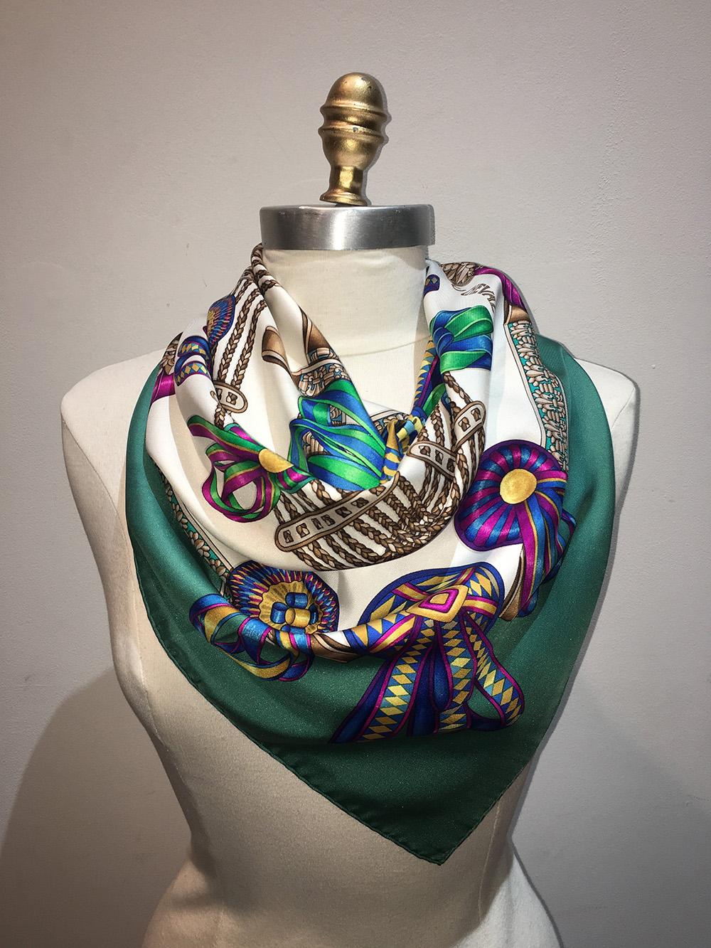 Beautiful Hermes vintage les Rubans du Cheval silk scarf in very good condition. Original silk screen design c1993 by Joachim Metz features an array of equestrian ribbons over a white background with a green border. 100% silk. hand rolled hem, made