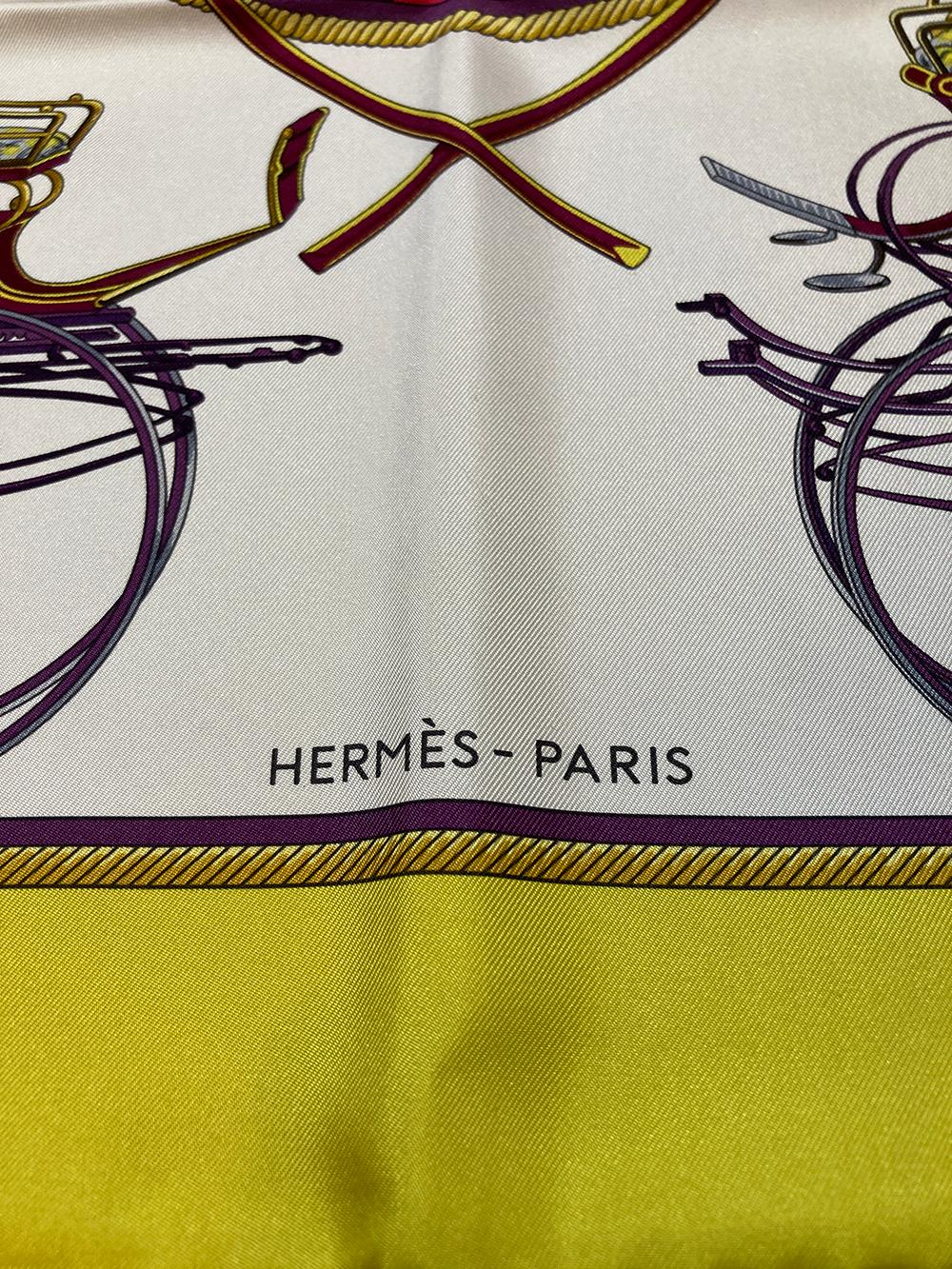 BEAUTIFUL Vintage Hermes Les Voitures a Transformation silk scarf in excellent condition.  Original silk screen design c1965 by Françoise De La Perriere features an assortment of traditional turn of the century style automobile designs over a white