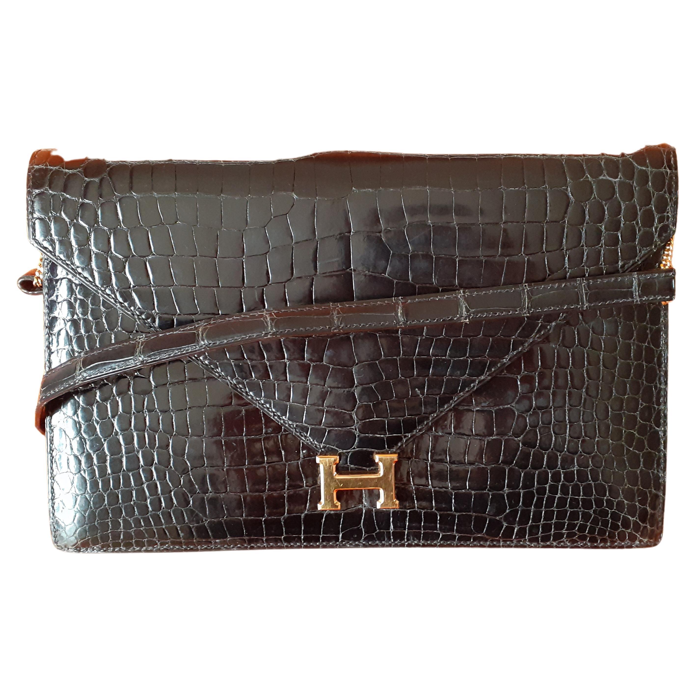 Hermès Vintage Lydie Bag Clutch 2 ways Black Shiny Crocodile Golden Hdw