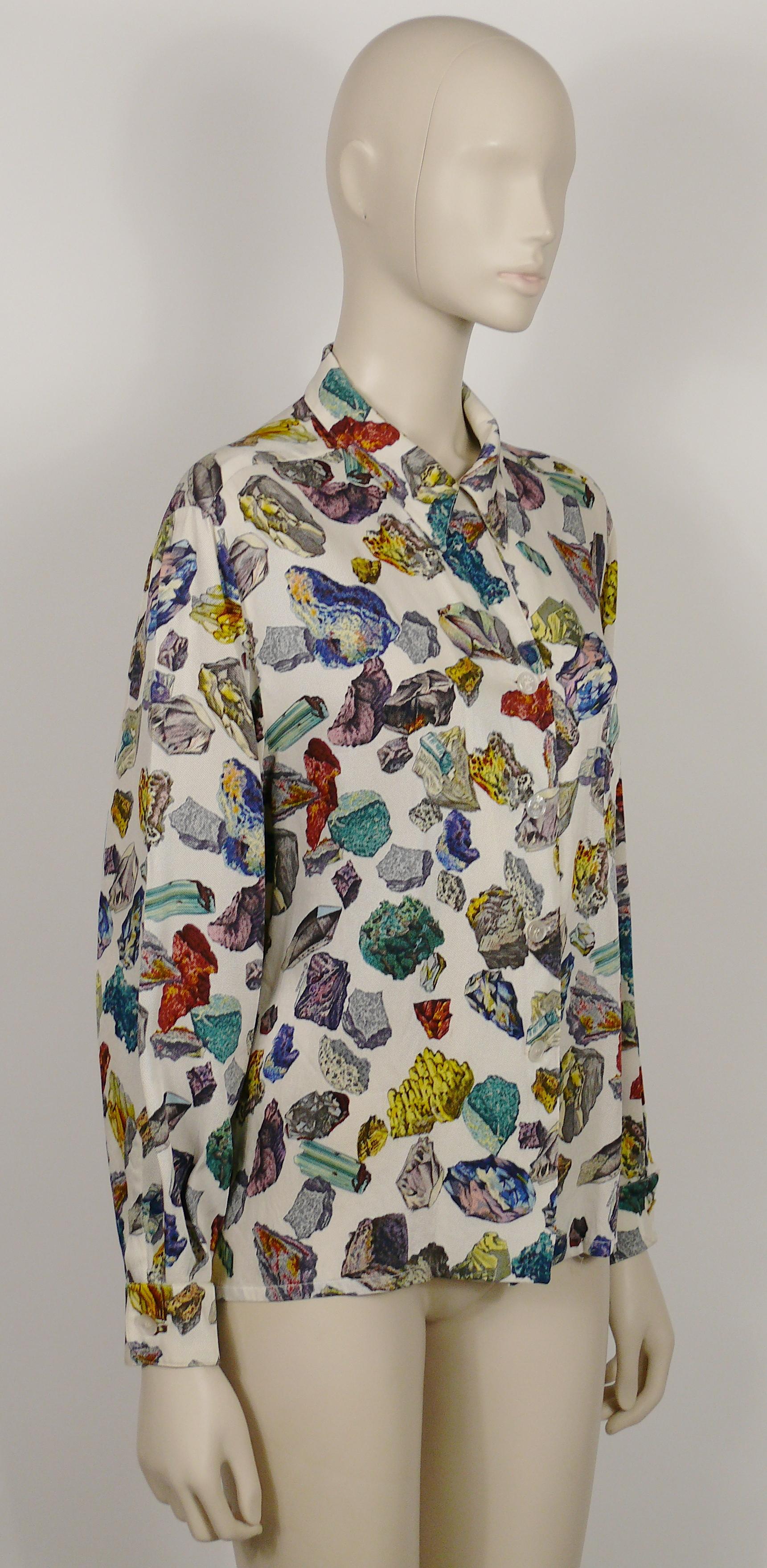 HERMES Paris vintage rare MINERAUX silk shirt blouse featuring a an opulent multicolored minerals on an off-white background.

This shirt features :
- Classic collar.
- Long sleeves.
- One breast pocket.
- Button down closure.
- Cuff