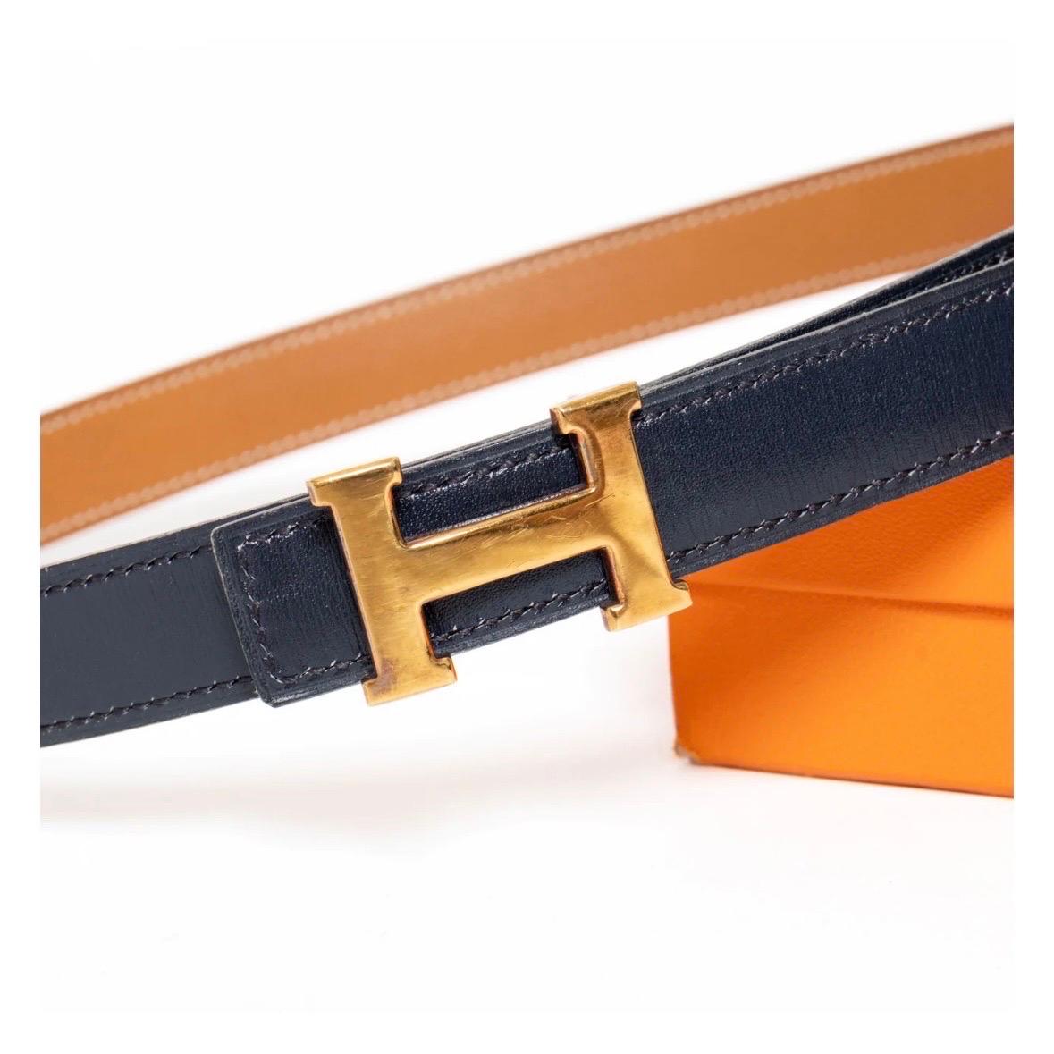 Vintage H Belt Trio by Hermès
Includes Navy, Tan, White
Reversible and interchangeable
Gold-tone hardware
H belt buckle 
Made in France
Condition: good; buckle slightly tarnished and scratched. Minor cracking on holes of Navy and Tan belts. White