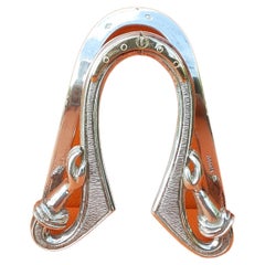 Fermasoldi vintage Hermès a forma di ferro di cavallo e mani in argento