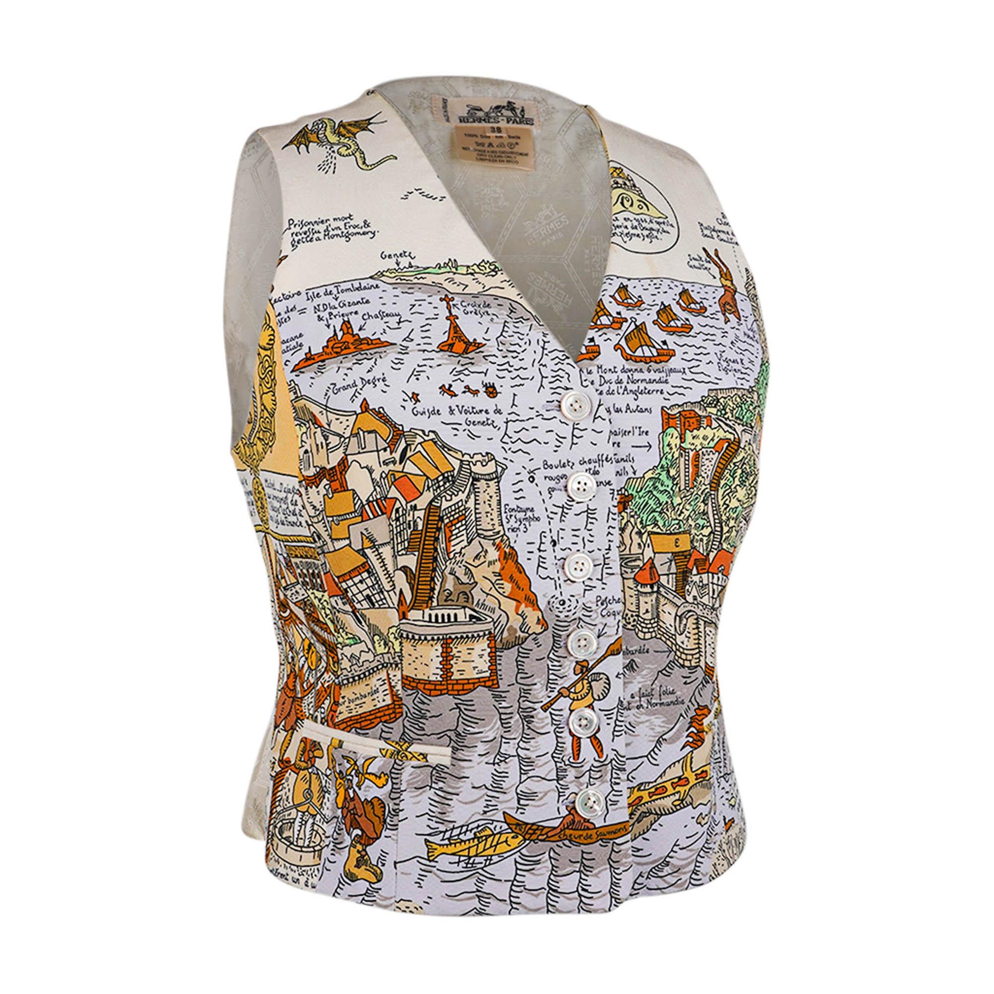Mightychic offers a rare vintage Hermes rare silk vest in the coveted Mont St. Michel print.
Vest has 3 mother of pearl buttons.
Designed and illustrated by Pierre Peron.
Features the iconic Mont St. Michel intricately depicted. 
A richly detailed