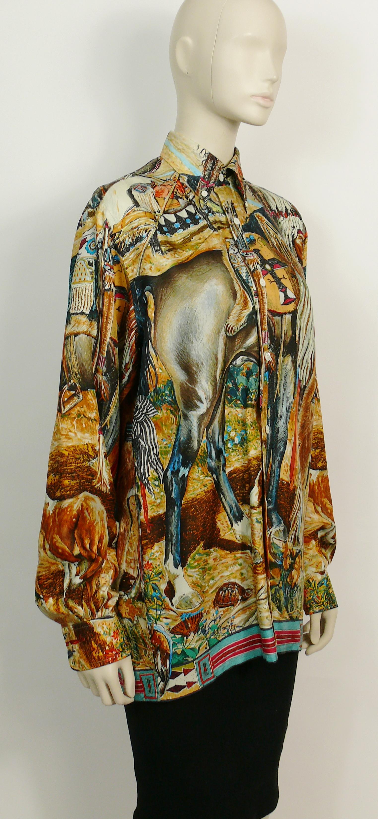 HERMES vintage rare Native American Indian print shirt designed by Texan artist KERMIT OLIVER

This shirt features :
- Multicolored opulent design featuring a multicolored Native American Indian print.
- Long sleeves.
- Front buttoning.
- Gold toned