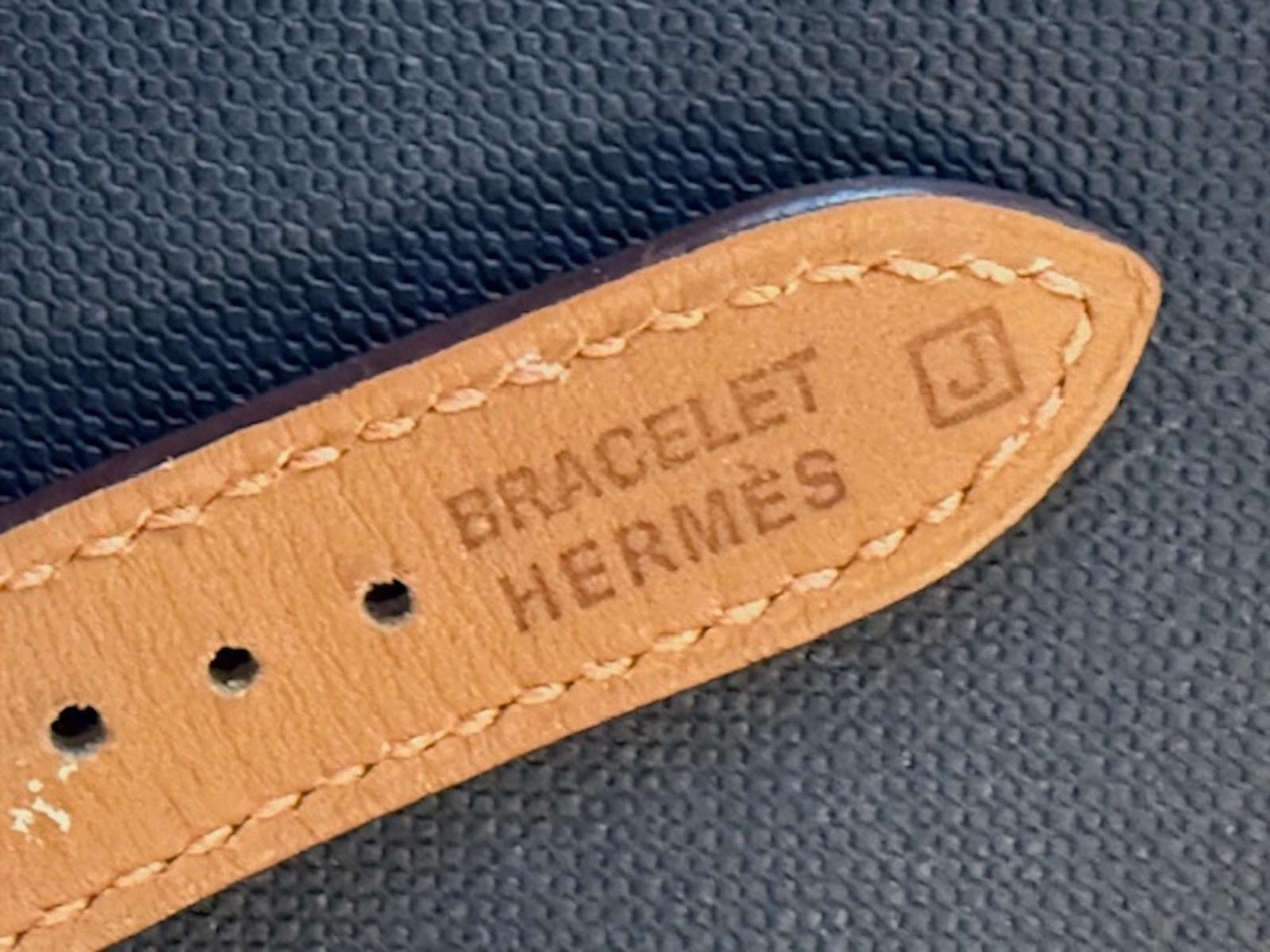 Hermès Vintage One-of-a-Kind Gold, Mahogany, Bone watch on orange leather strap In Excellent Condition For Sale In New York, NY