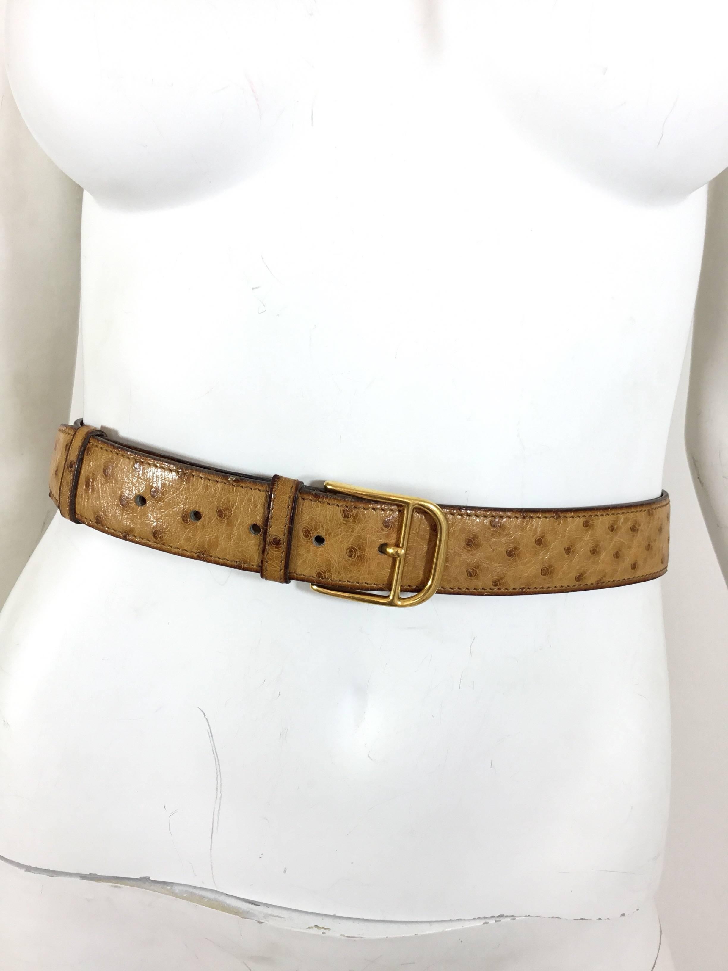 Vintage Hermes ostrich belt featured in Hermes gold color with gold-tone hardware. Belt measures 93 cm long (36.5 in) and 3.5 cm wide (1 in). Belt has leather stampings of an O  in a circle (date stamp for 1985), 90 (size in CM or 35