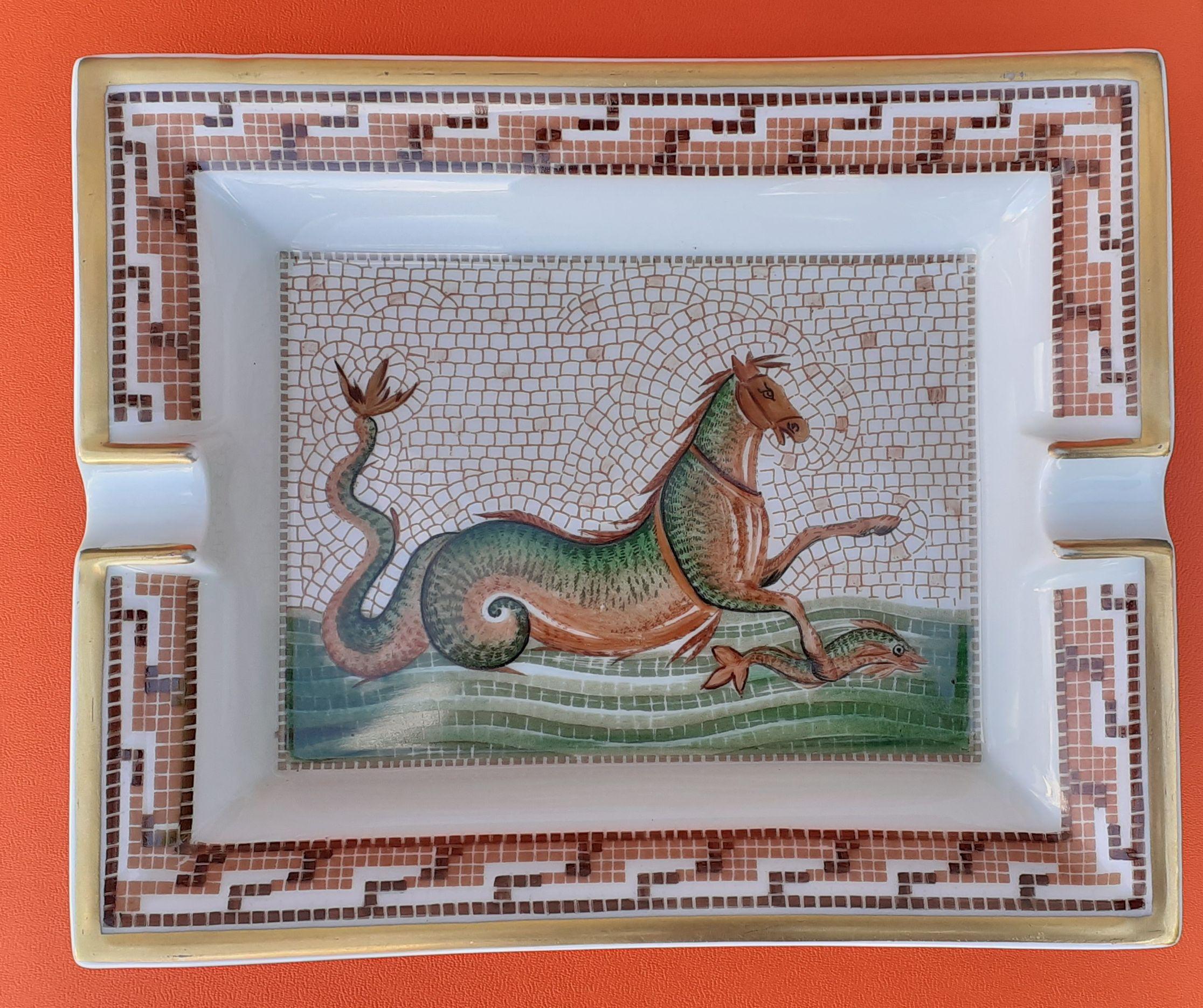 Beautiful and Rare Authentic Hermès Ashtray

Pattern: Seahorse

This creature is from the greek mythology. It has a horse front, and a fish or snake rear part

Made in France

Made of Porcelain with golden edges

Colorways: White, Brown, Green,