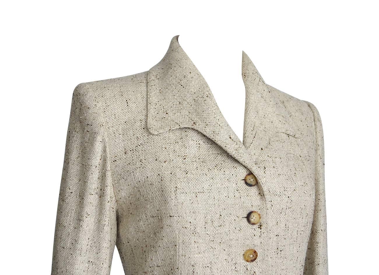 Talk about a collectors piece from Hermes.
Raw silk in an oatmeal colour with brown flecks make this a divine year round jacket.
6 button single breast magnificently shaped jacket.
Bbeautifully shaped lapel and jacket appear to be one running piece