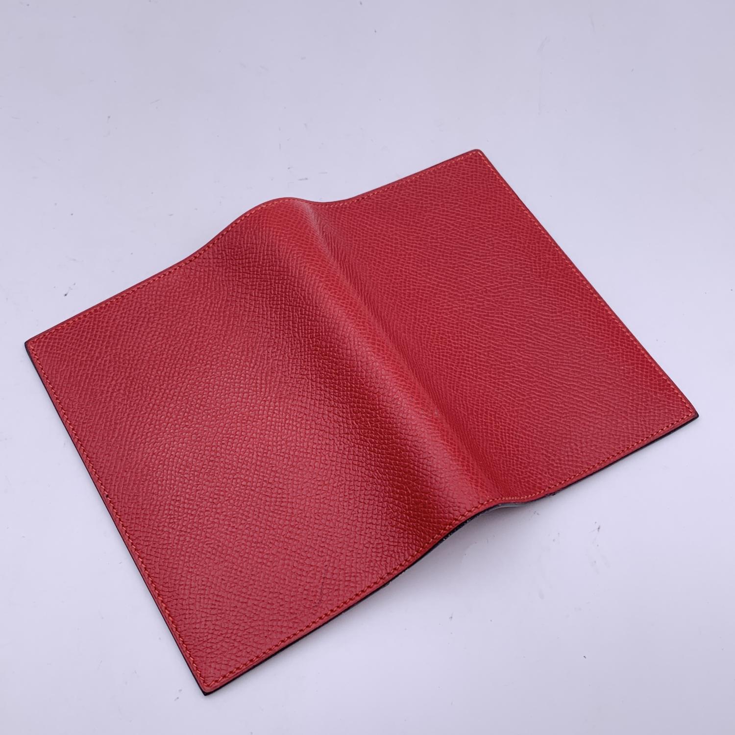 Vintage Agenda/Notebook 'Simple' cover by Hermes crafted in red leather. Silver metal binding in center and 1 slot for a notebook on each side. 'HERMES Paris - Made in France' embossed inside, blind stamp is a 'R' in a Circle (which means that the