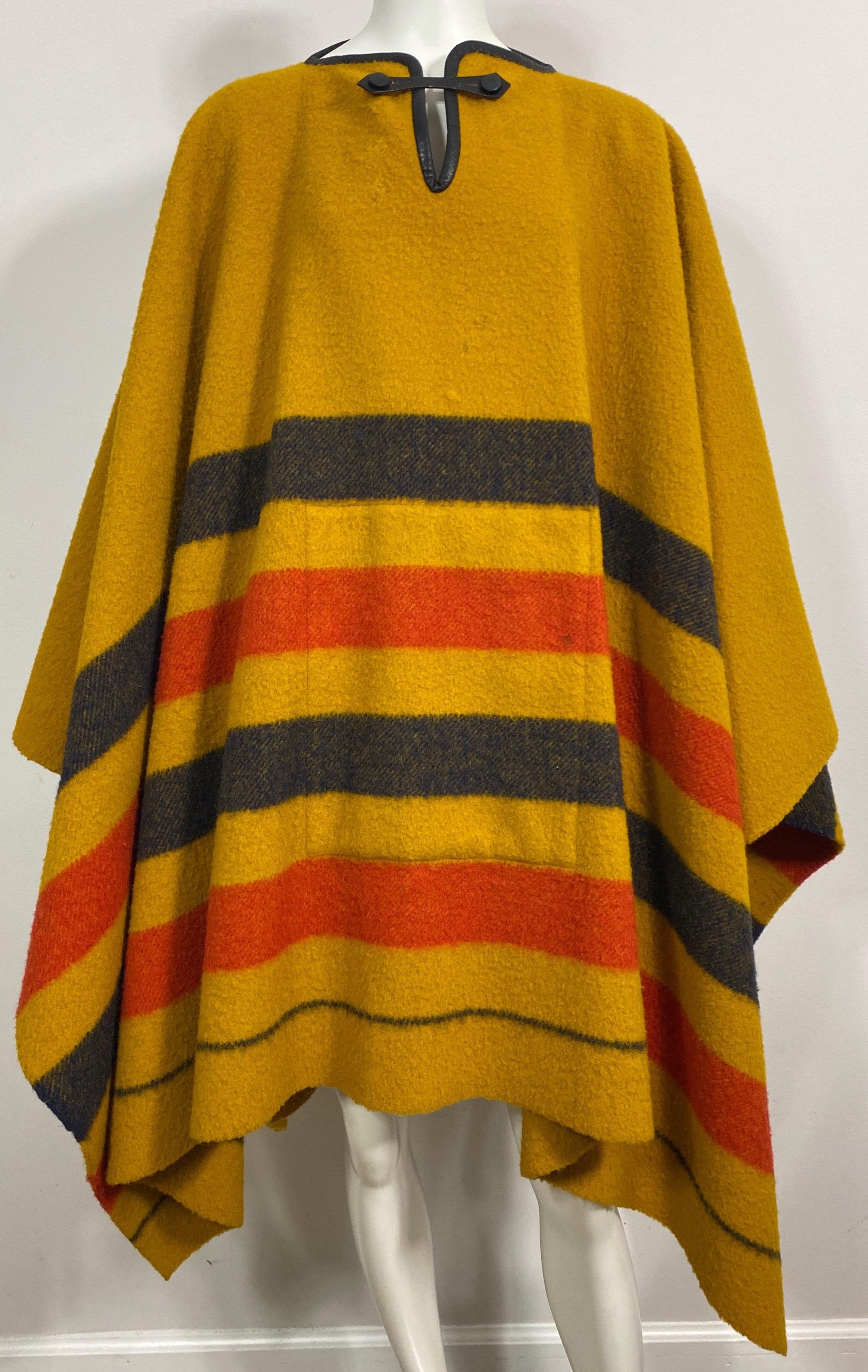 Hermes Vintage Rocabar Wool Large Poncho - One size fits all. This thick 100% wool Hermes poncho is in the Rocabar fabric which is a mustard like base color with 3” horizontal alternating stripes of chocolate brown and red (4 total) and then a 1/8”