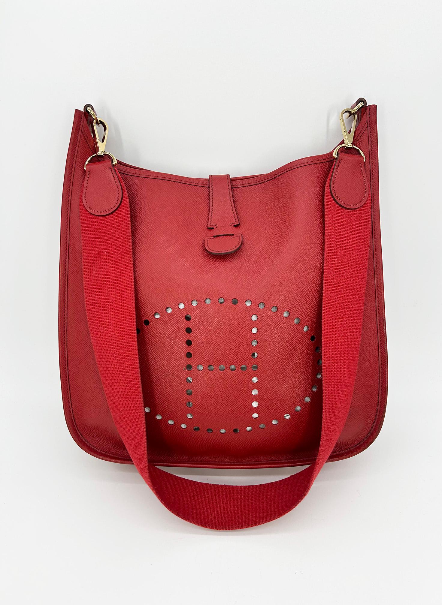 Hermes Vintage Rouge Epsom Evelyne GM III 29 in very good condition. Rouge epsom leather exterior trimmed with gold hardware. Light signs of wear throughout consistent with age and gentle use. Some scuffs throughout exterior leather, light patina on