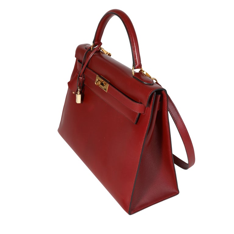 Sold at Auction: HERMÈS, Kelly Retourné 32 bag, Rouge H box calf leather,  with gilt metal hardware