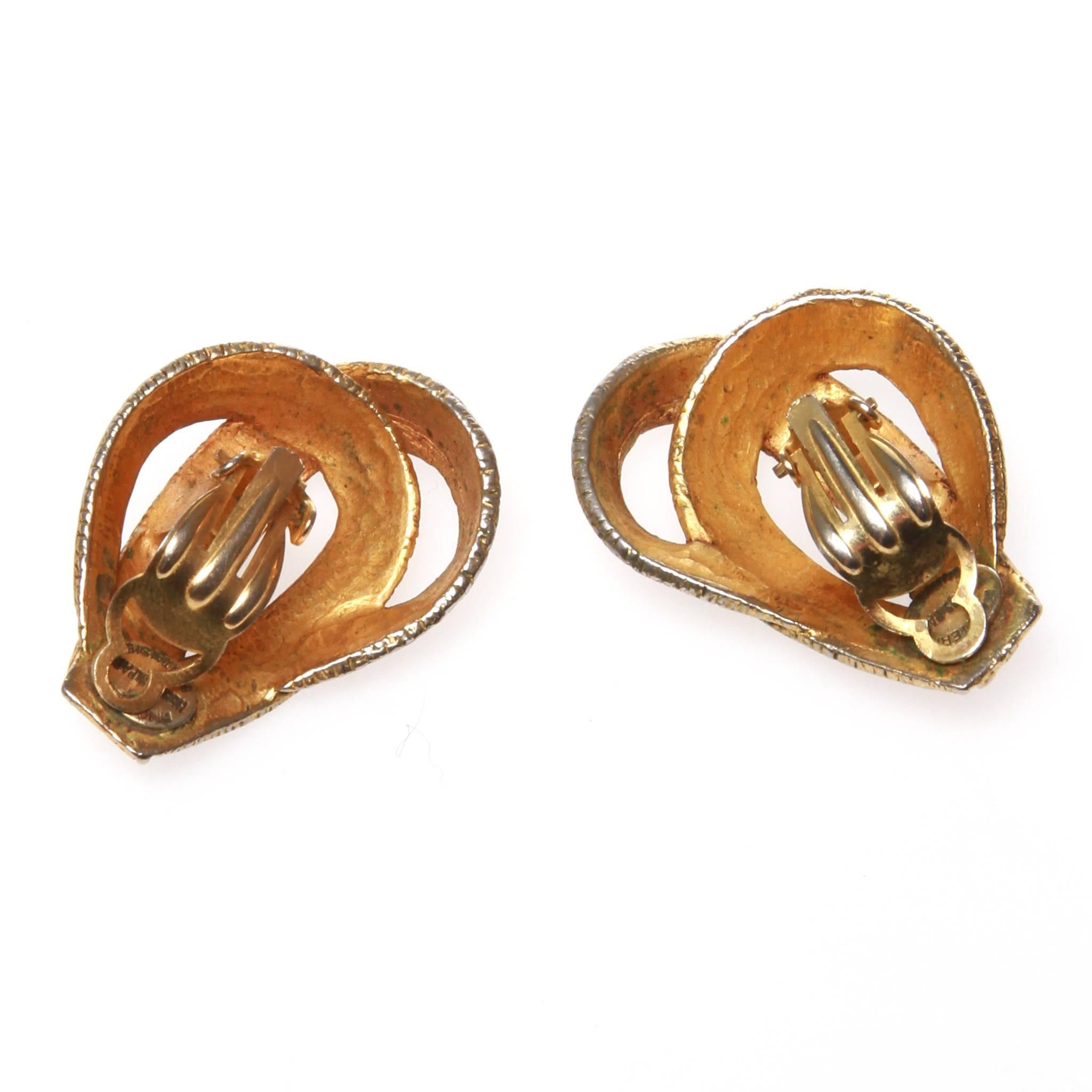 Hermes vintage 'Ruban' earrings featuring engraved gold-tone metal to look like the signature Hermes ribbon. 