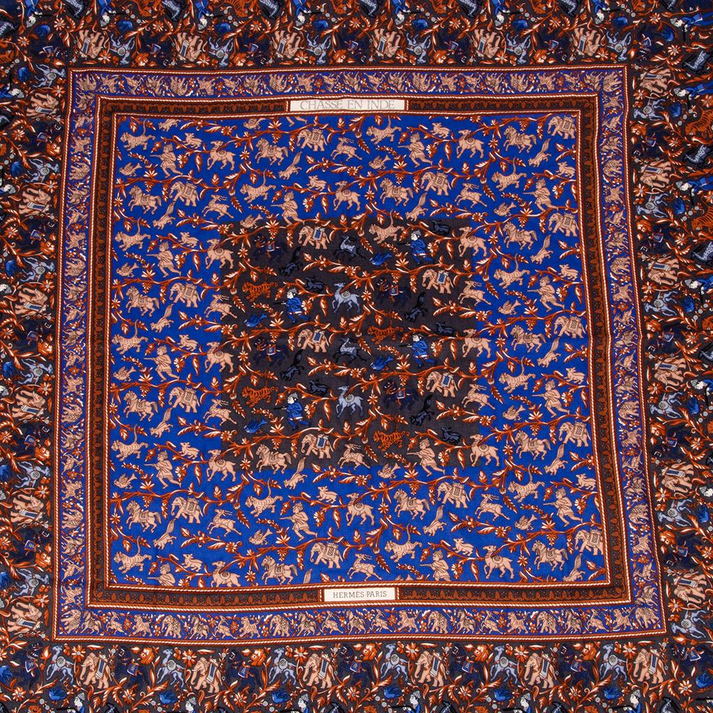 Guaranteed authentic Hermes vintage GM shawl / scarf 140 cm featured in the coveted rare Chasse en Inde print.
Highly collectible print large cashmere and silk shawl.
Rich blue colorway.
Extremely intricate resplendent with tigers, gazelles, and