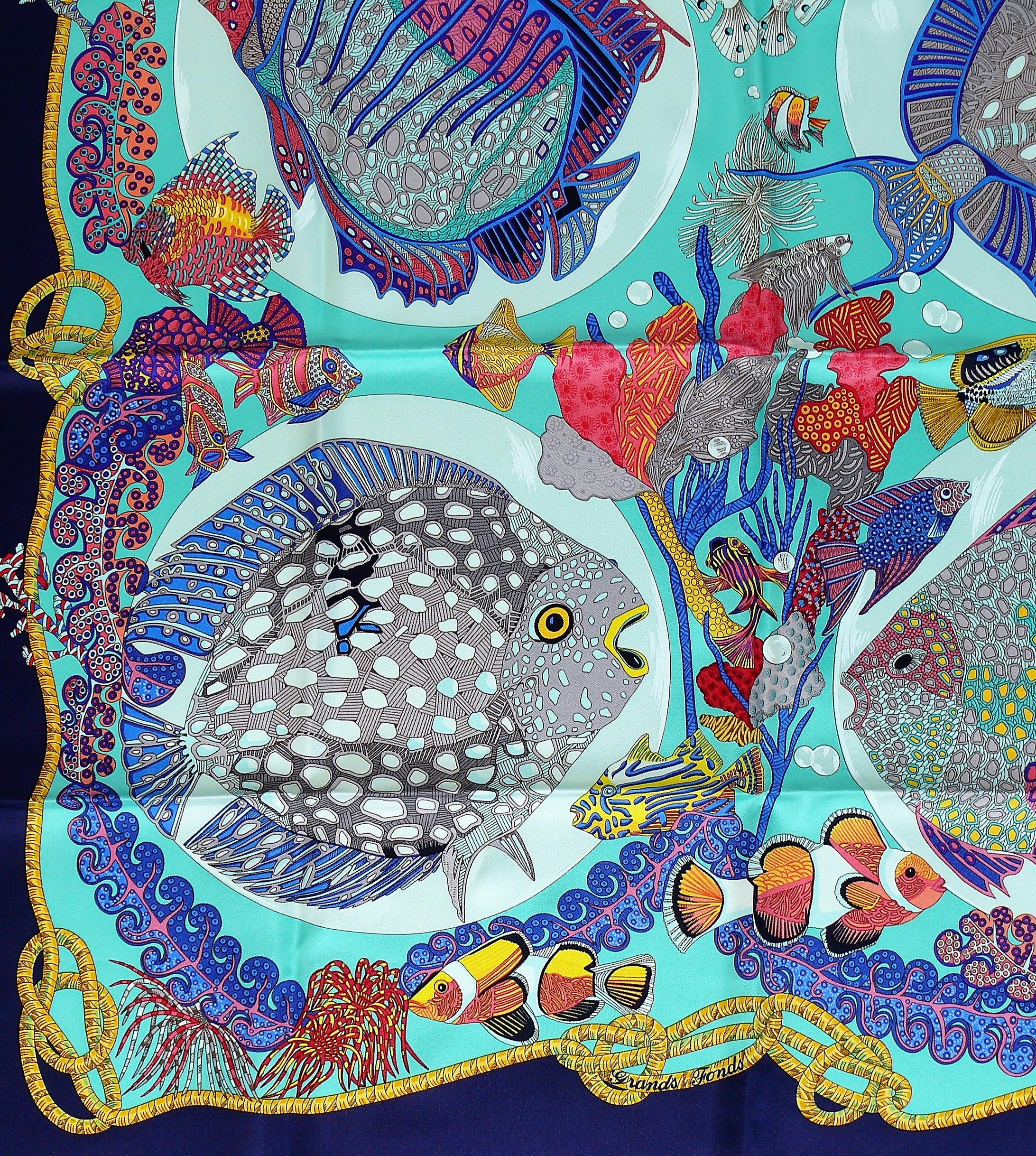 HERMES vintage 1992 hard to find silk carre scarf GRANDS FONDS featuring a gorgeous opulent and vibrant sea-life design.

Designed by ANNIE FAIVRE.

This scarf features :
- Crispy silk.
- Hand rolled borders.
- Plump hems.
- 100 % silk.

Marked ©