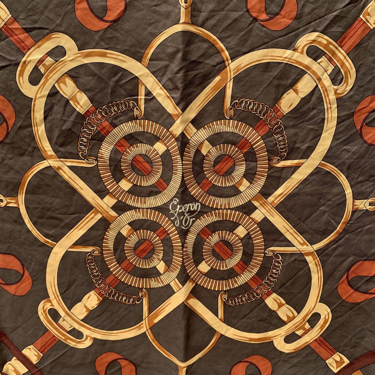 HERMES silk scarf named 'EPERON D'OR', designed by Henry D'Origny and issued the first time in 1974. This drawing of Henri d'Origny inspired from the equestrian world, illustrates in an interlacing of flanges, rings, hunting crop and stirrups, the