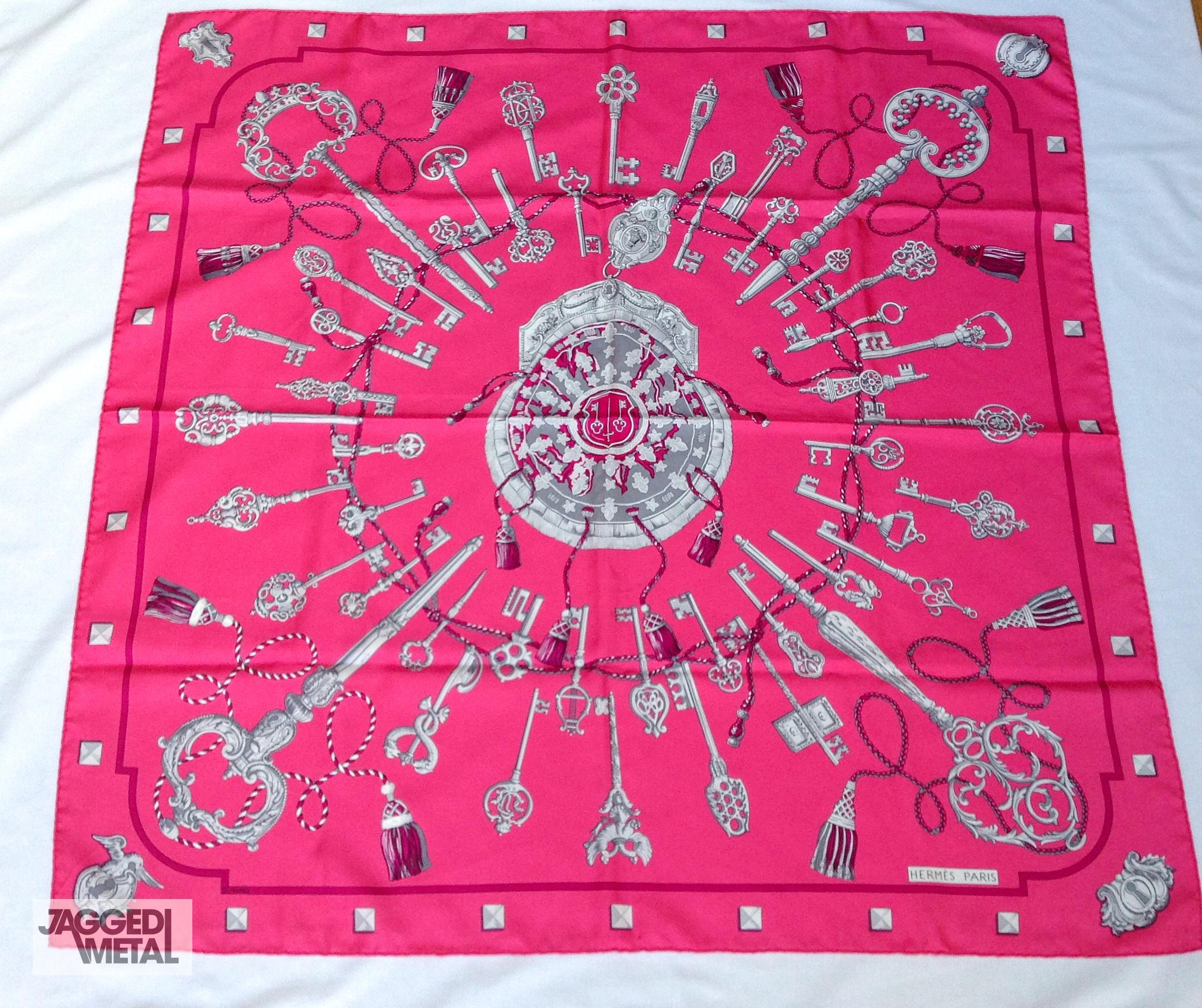 Vintage HERMÈS Silk Scarf Fuchsia LES CLÉS 90cm CATY LATHAM 

This iconic Hermes scarf was first issued in 1965 and due to its overwhelming popularity has been reissued numerous times. 

This colourway is a stunning fuchsia pink with grey/silver