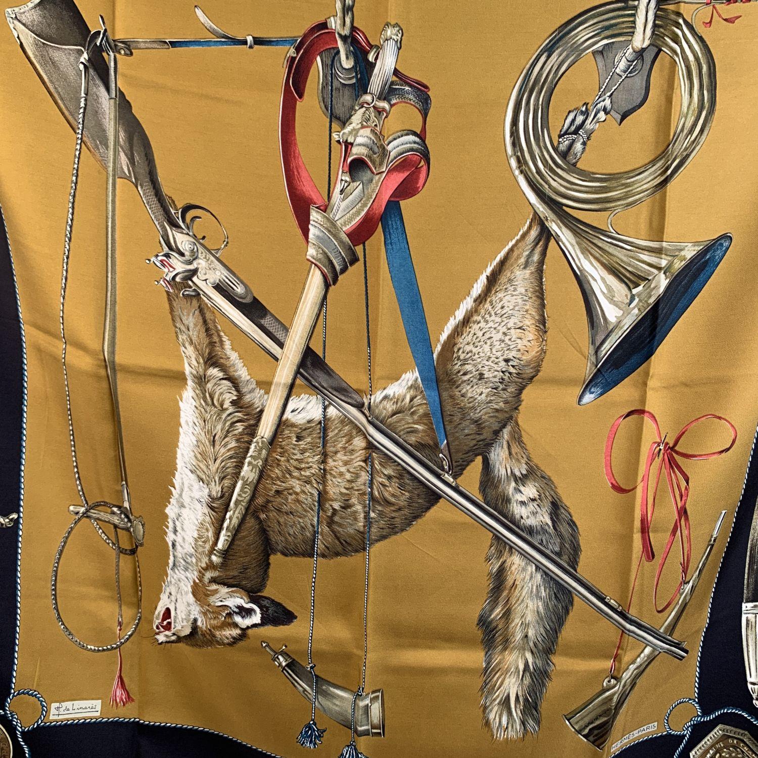Rare classic Hermes ' Le Renard' silk scarf designed by Henri De Linares and originally issued in 1967. It depicts a fox that has just been hunted surrounded by tools used in hunting. Main colors are beige and black.. Hand rolled edges. Approx.