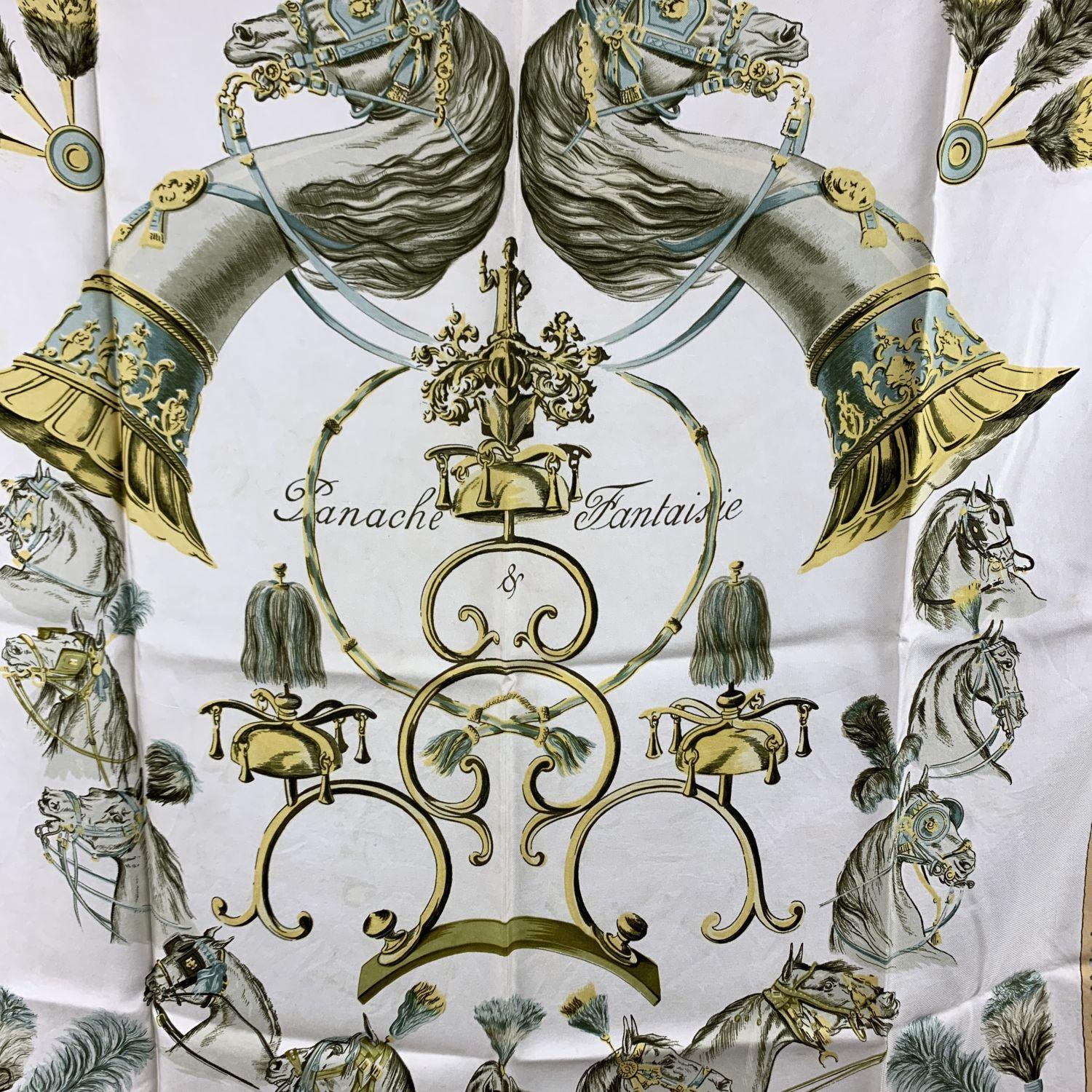 Rare vintage silk scarf named 'PANACHE ET FANTASIE' designed for Hermes by Hugo Grygkar. This scarf was issued for the first time in 1959.

- Title: 'PANACHE ET FANTASIE' by Hugo Grygkar
- It first issued in 1959
- 100% Silk
- Main colors: White,
