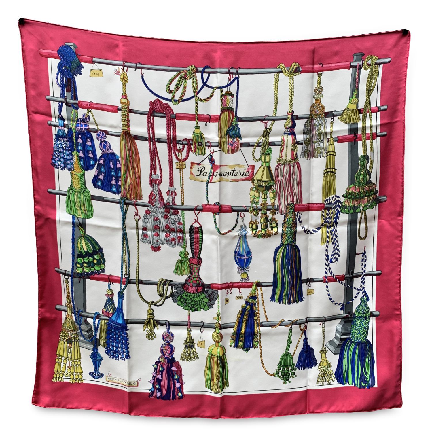 Vintage HERMES scarf 'Passementerie' was designed by Francoise Heron and first issued in 1960. Multicolor tassels design with magenta borders. The 'HERMES Paris' signature with copyright symbol in the lower border. 100% silk. Approx measurements: 35
