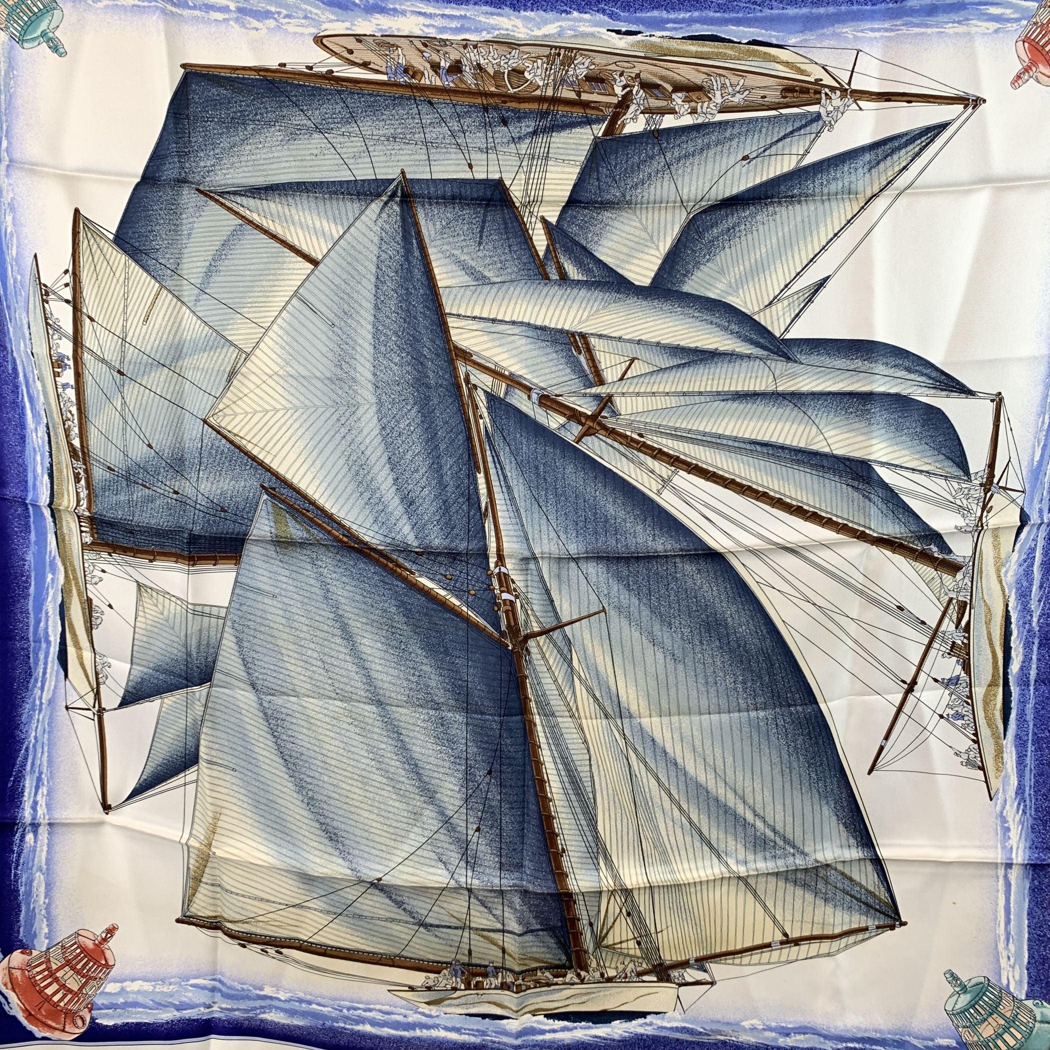 Set sail into timeless elegance with this rare 'Vent Portant' silk scarf from Hermès, designed by Yannick Manier in 1988 and reissued in 1992. A true celebration of the art of sailing, this vintage scarf features a striking yacht design set against