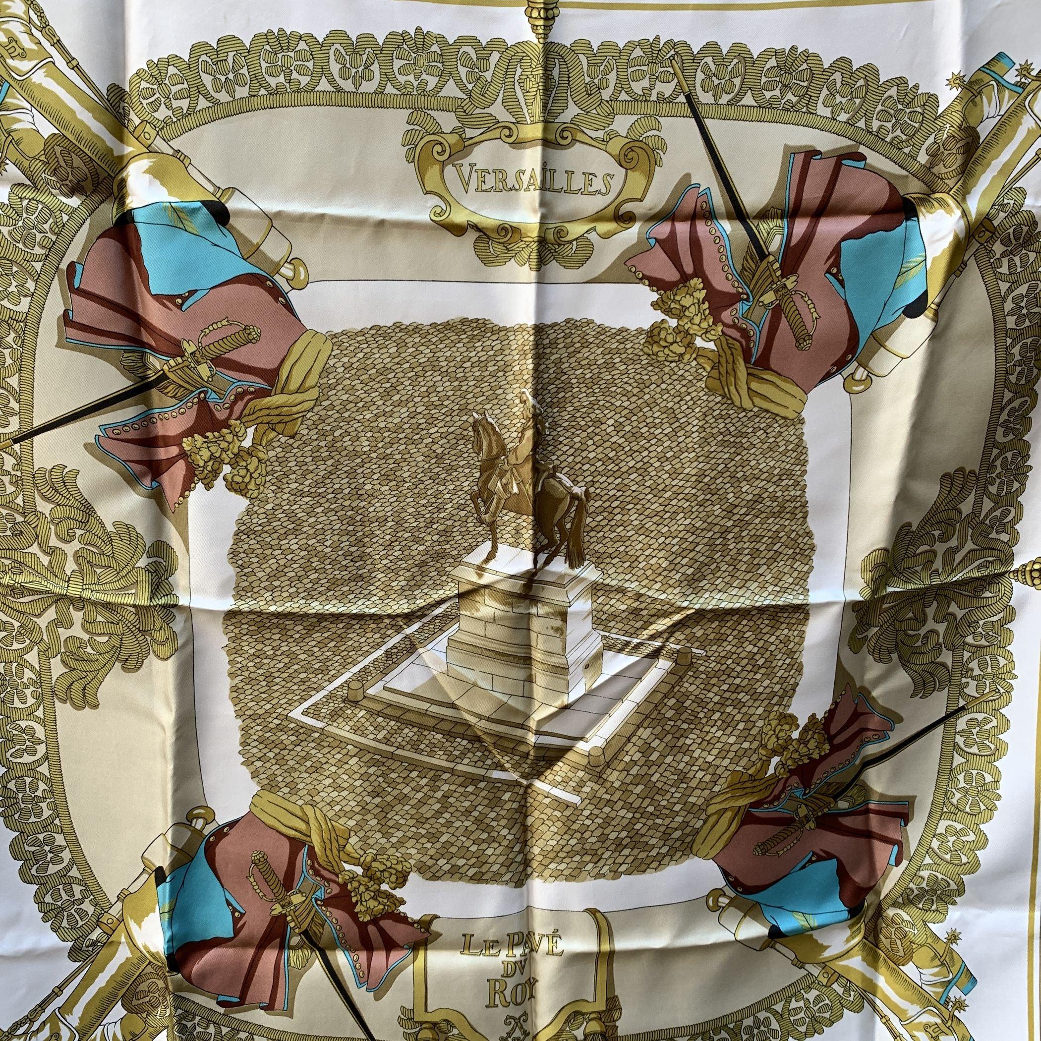 Step into the grandeur of history with the Hermès silk scarf titled Le Pavé du Roy (King's Pavement), a stunning design by Hugo Grygkar from 1953/54 and re-issued in 1975. This bold and captivating design features the bronze statue of King Louis