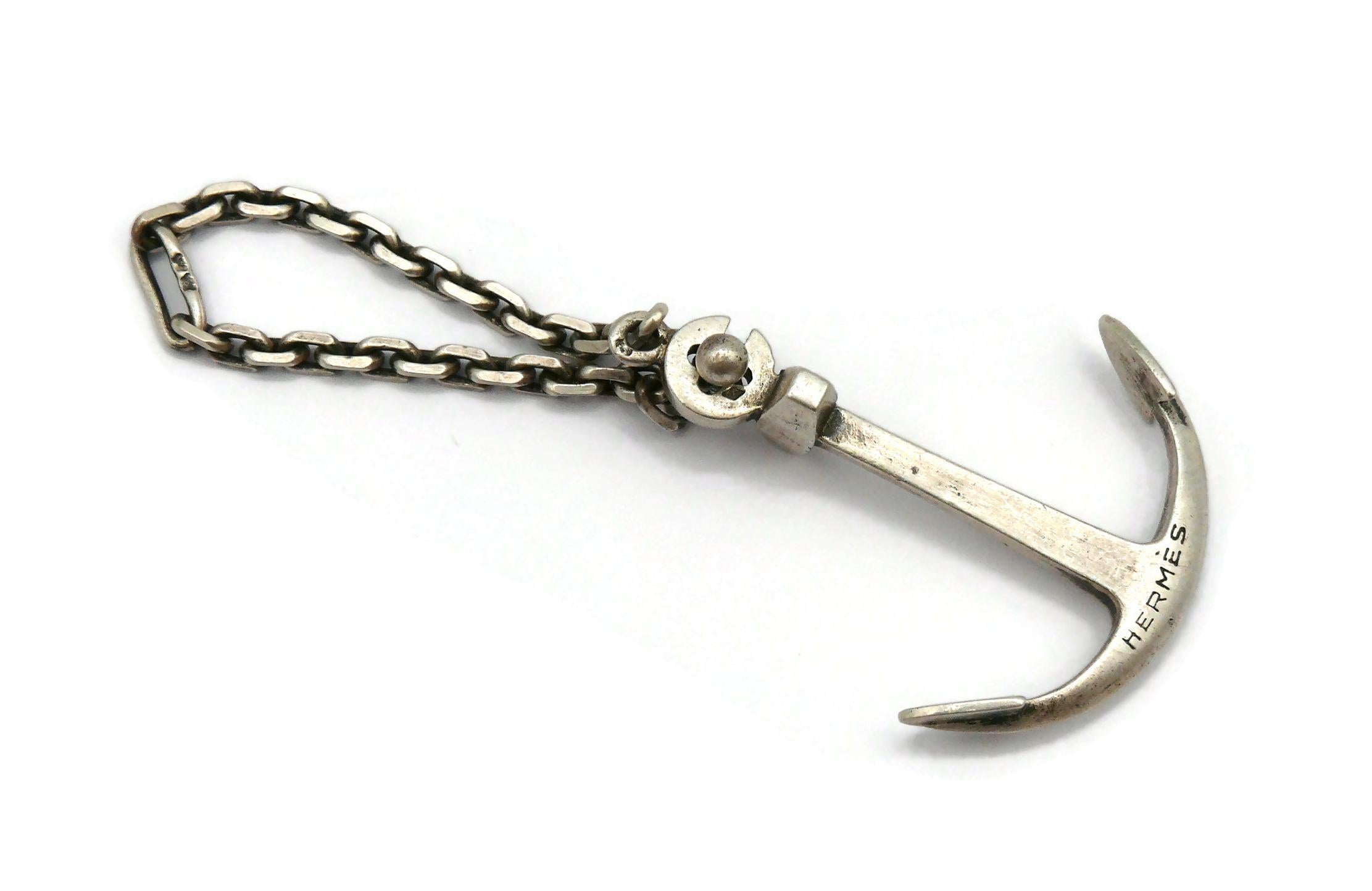 HERMES vintage silver boat anchor keychain.

Promotional item for Ancre Pils (first beer brewed at the Brasserie de l'Espérance, founded in 1746 in Strasbourg, France).

Embossed HERMES and ANCRE PILS.
French silver crab hallmarks.
Silmersmith