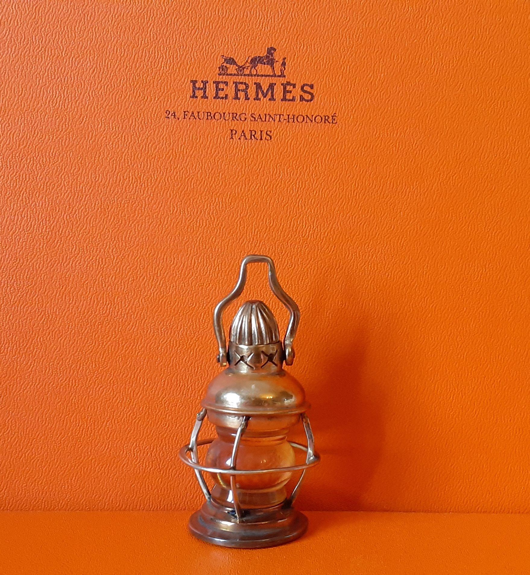 Rare Authentic Hermès Lantern

Please note: it is a decorative item only. Is not functional. Not a toy.

Shape of a storm boat lantern

Made of plastic (or glass) and non precious metal

Can be hung

Vintage Item 

