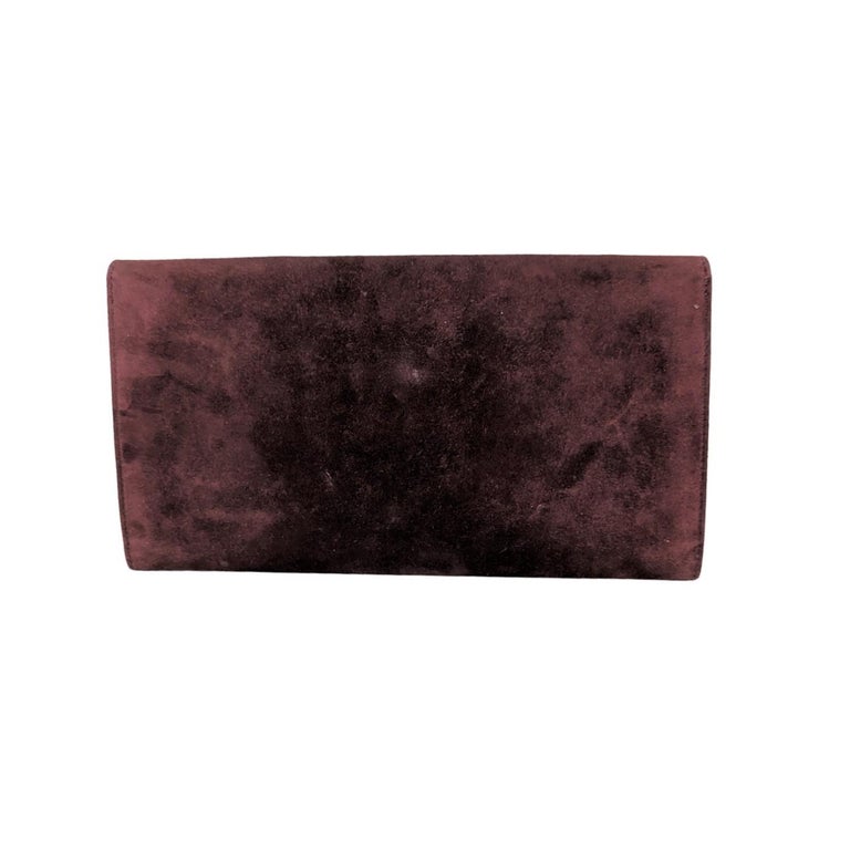 Hermes Vintage Rio Envelope Clutch in Burgundy. This timeless envelope-style clutch is crafted of suede. It features a flap with snap closure, palladium hardware, and tonal leather interior. Made in France. Blind stamp reads: Square H