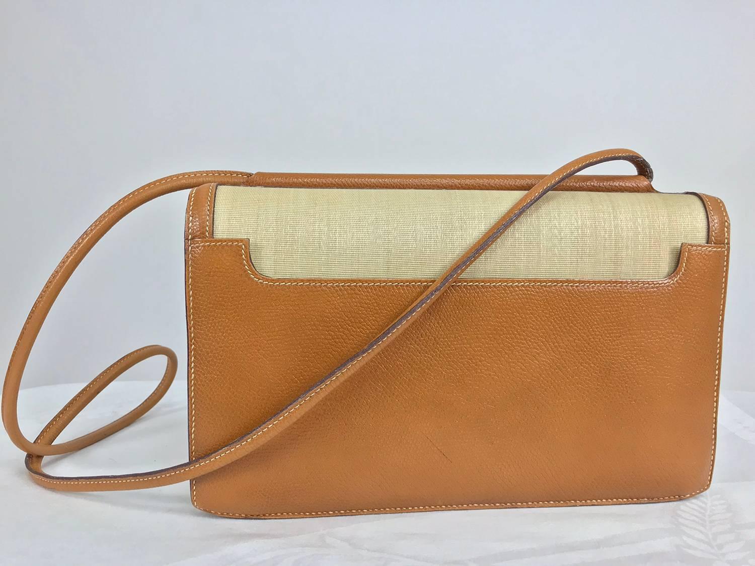 Hermes Vintage textured tan Leather and horsehair crinoline shoulder bag dated K in a circle 1981. Stitched in cream. Envelope shape bag has a shaped flap with a leather covered bar at the bottom that has gold plated ends. the bag closes with two