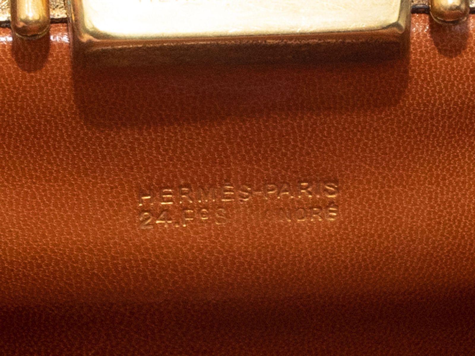 Product Details: Vintage Tan Hermes Rare Sac Malette Bag. The Sac Malette features a leather body, gold-tone hardware, single rolled top handle, and front push-lock closure. 11