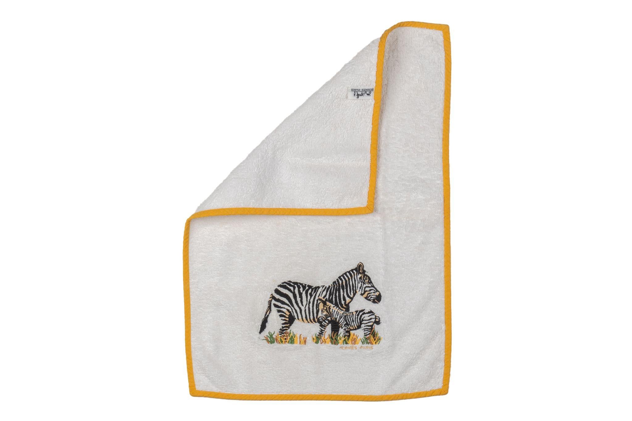 Hermès vintage white cotton terry cloth towel with yellow trim. Embroidered zebra design.
No box.