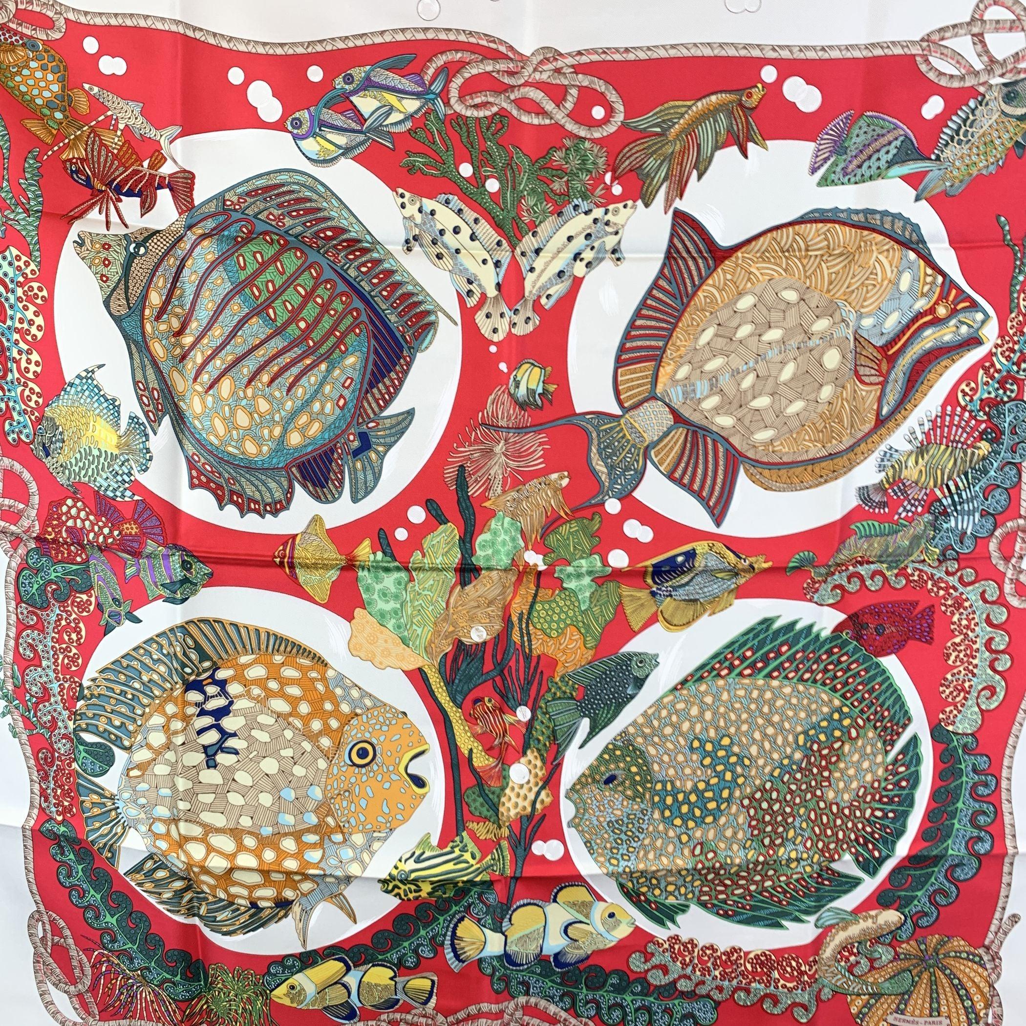 This beautiful Hermes silk scarf, 'Grands Fonds' (Great Deeps), designed by Annie Faivre, is a stunning tribute to the vibrant and mysterious world beneath the sea. First issued in 1992, this design was so beloved that it was reissued multiple