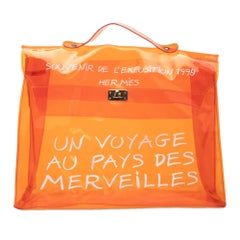 Hermès Vintage 1990s Unisex Orange Vinyl Kelly Handbag with Turn Lock