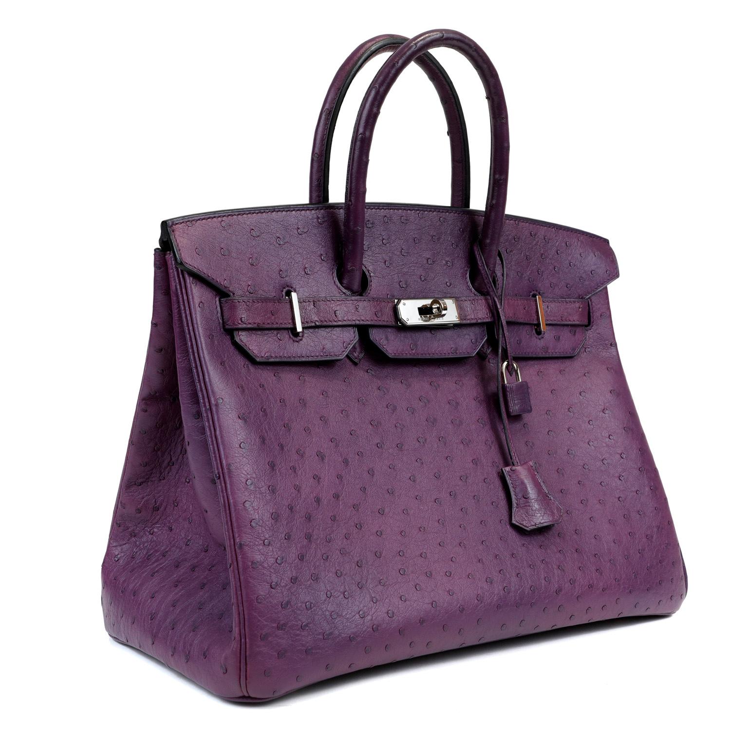 This authentic Hermès Violet Ostrich 35 cm Birkin is in excellent condition.
Hermès bags are considered the ultimate luxury item the world over. Hand stitched by skilled craftsmen, wait lists of a year or more are commonplace for the bovine